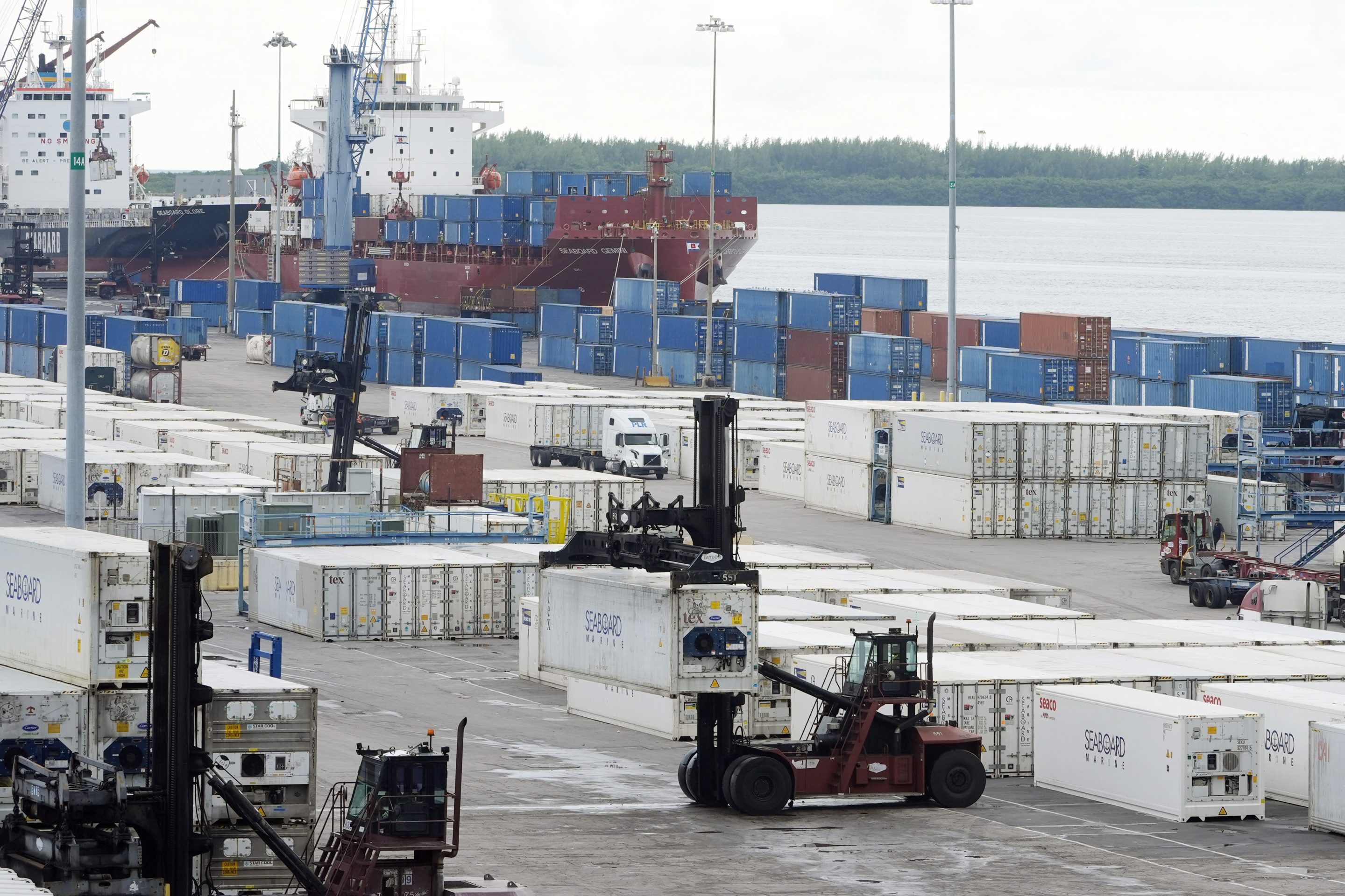 Dockworkers return to work at Port Miami, Oct. 4, 2024, in Miami.