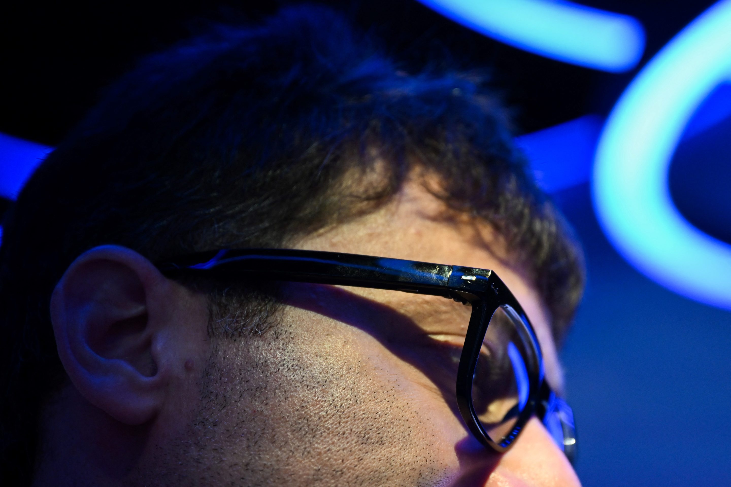 An attendee demonstrates the EssilorLuxottica SA Nuance Audio OTC hearing aid glasses displayed at the Consumer Electronics Show (CES) in Las Vegas, Nevada, on January 7, 2025.