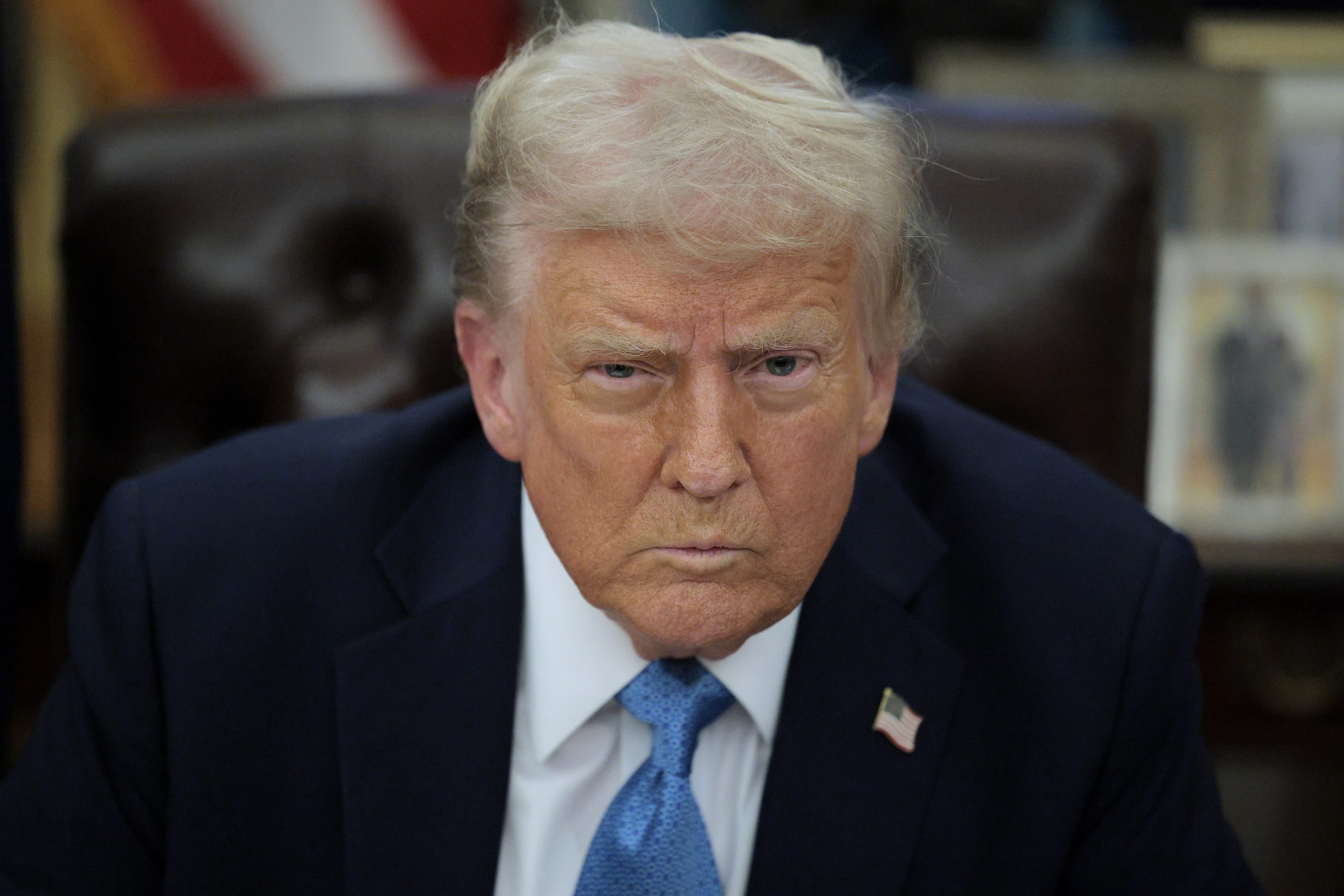 U.S. President Donald Trump talks to reporters after signing an executive order, "Unleashing prosperity through deregulation," in the Oval Office on January 31, 2025 in Washington, DC.