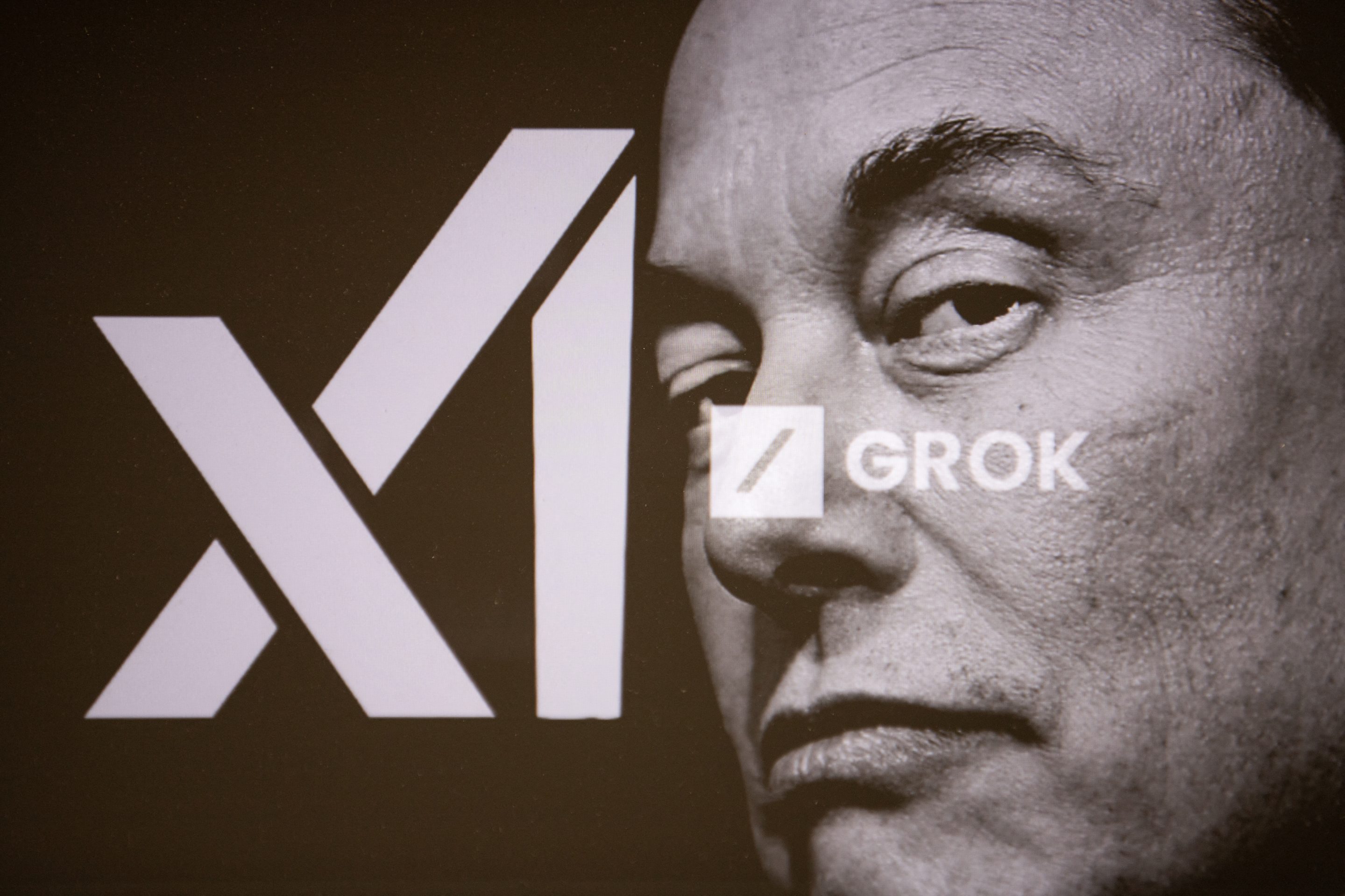 Elon Musk's face superimposed on the logo for his AI company xAI