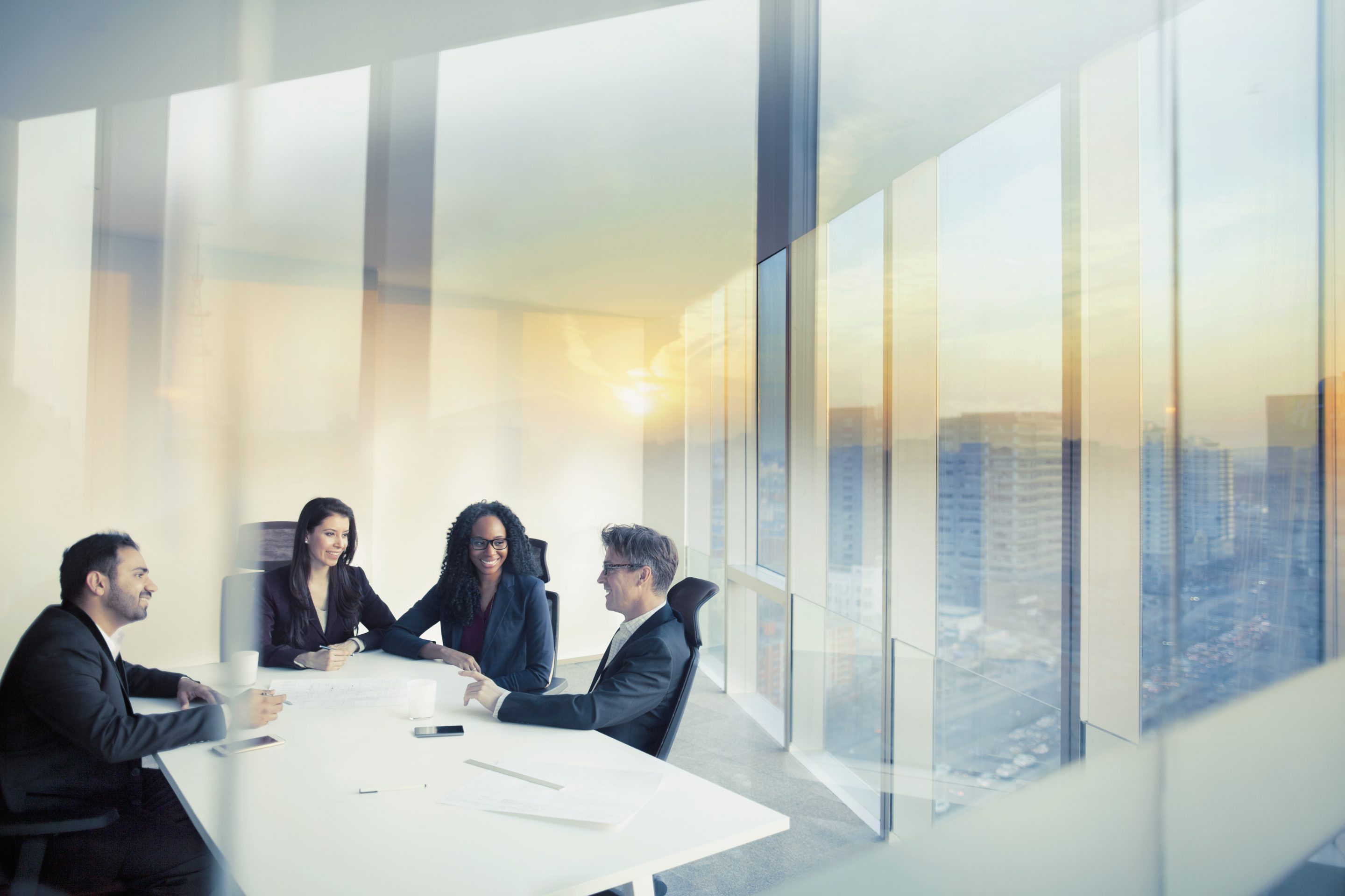 office workers convene in a meeting room