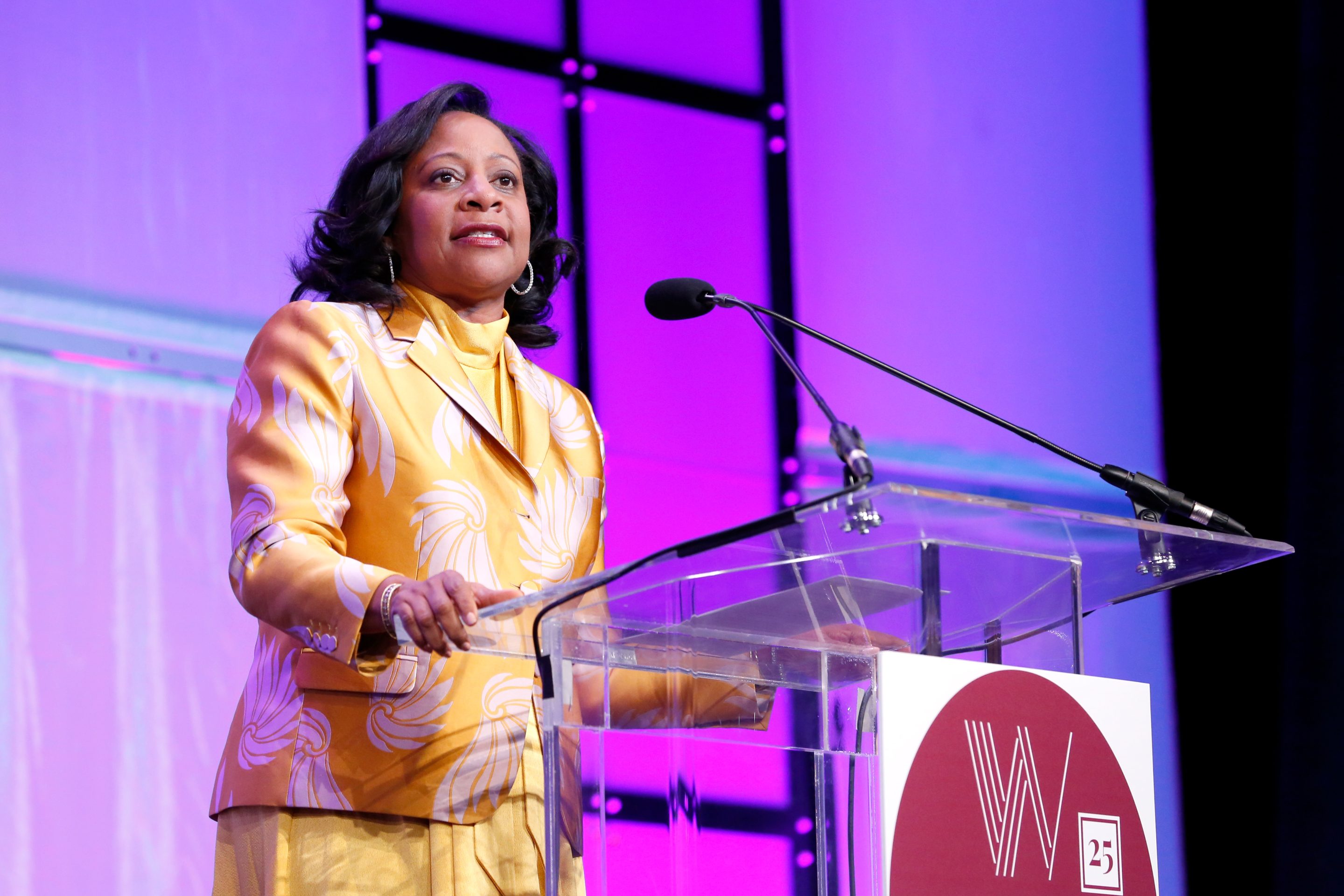 businesswoman speaking onstage