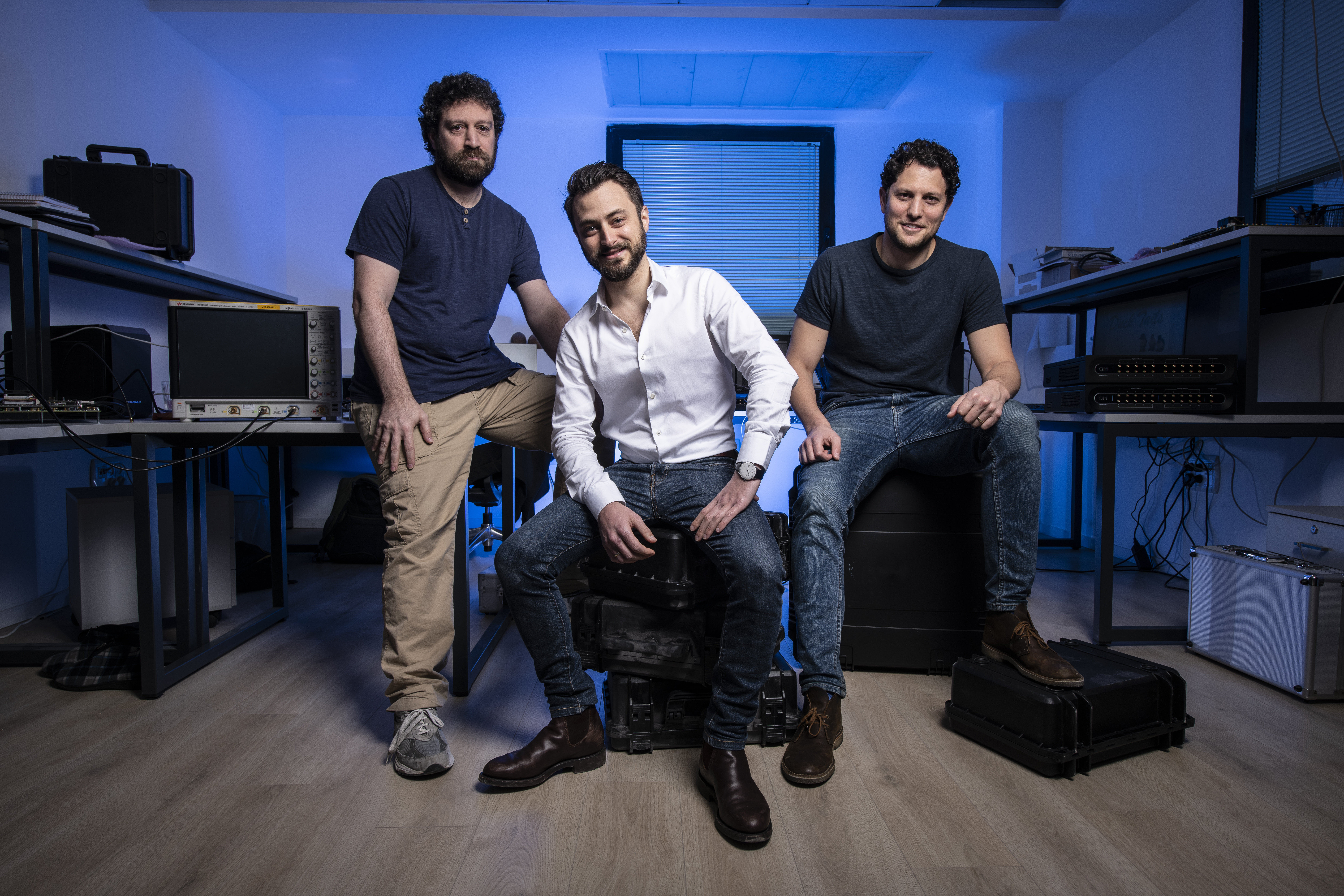 Picture of the QM founders, Dr Yonatan Cohen, Dr Itamar Sivan, Dr Nissim Ofek sitting in black cases.