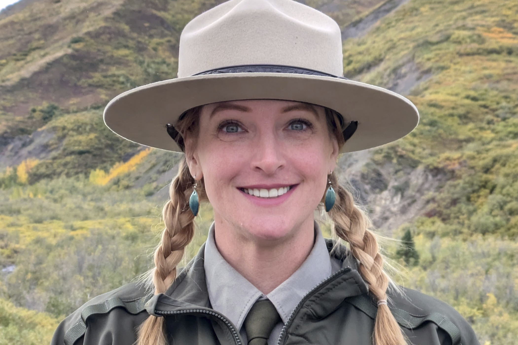 This photo provided by Kristin Jenn shows her in her National Park Service ranger uniform in Denali National Park and Preserve in Alaska in October 2024, while she was a seasonal worker for the NPS.