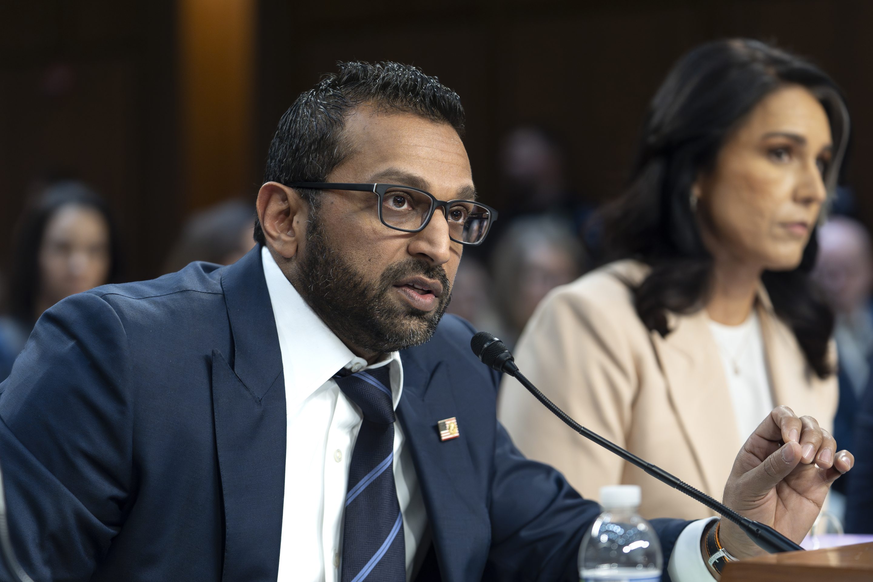 FBI Director Kash Patel, joined at right by Director of National Intelligence Tulsi Gabbard, answers questions as the Senate Intelligence Committee holds its worldwide threats hearing, on Capitol Hill in Washington, on March 25, 2025. 