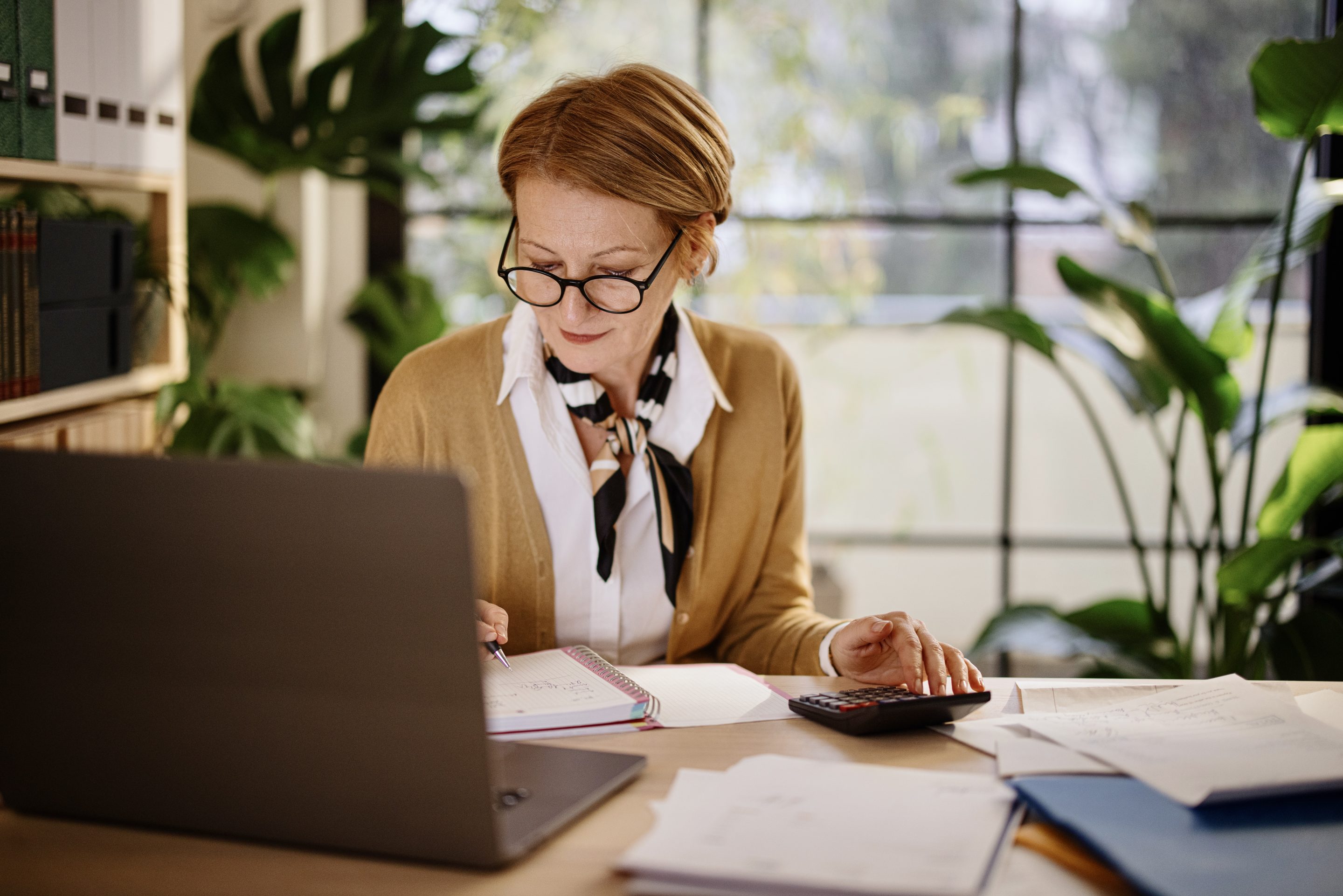 woman working on calculator