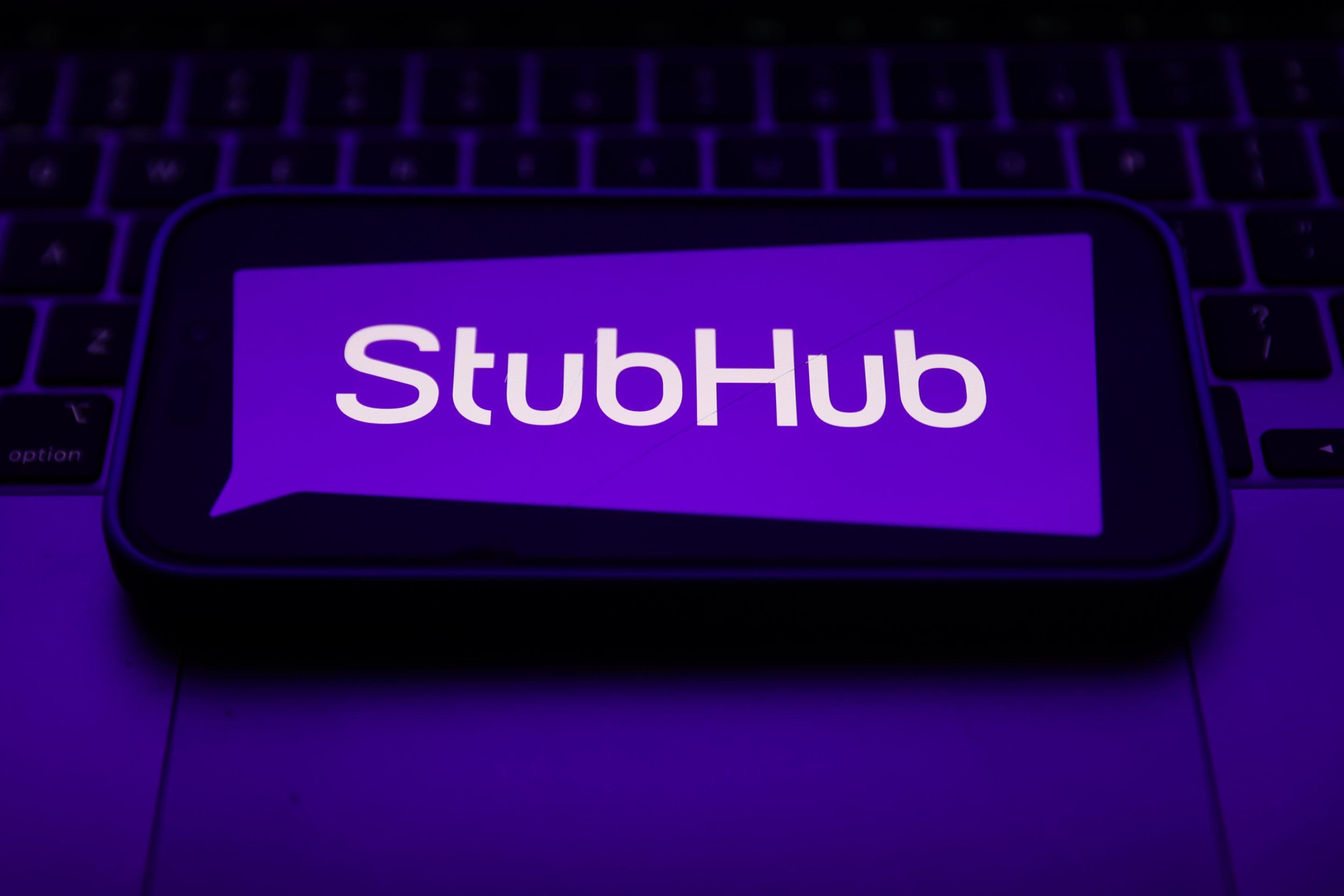 The StubHub logo on a phone screen.