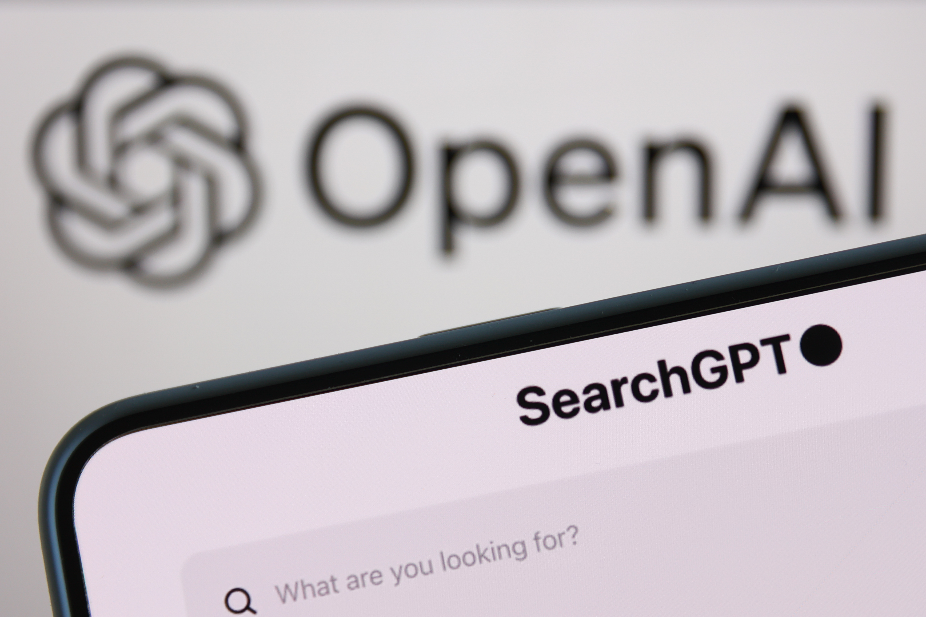 An image of OpenAI's SearchGPT with the company's logo in the background.