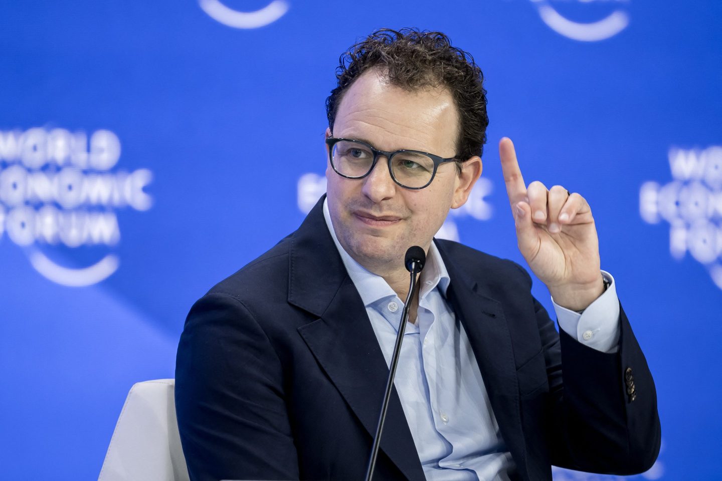 Anthropic CEO Dario Amodei raising his index finger.