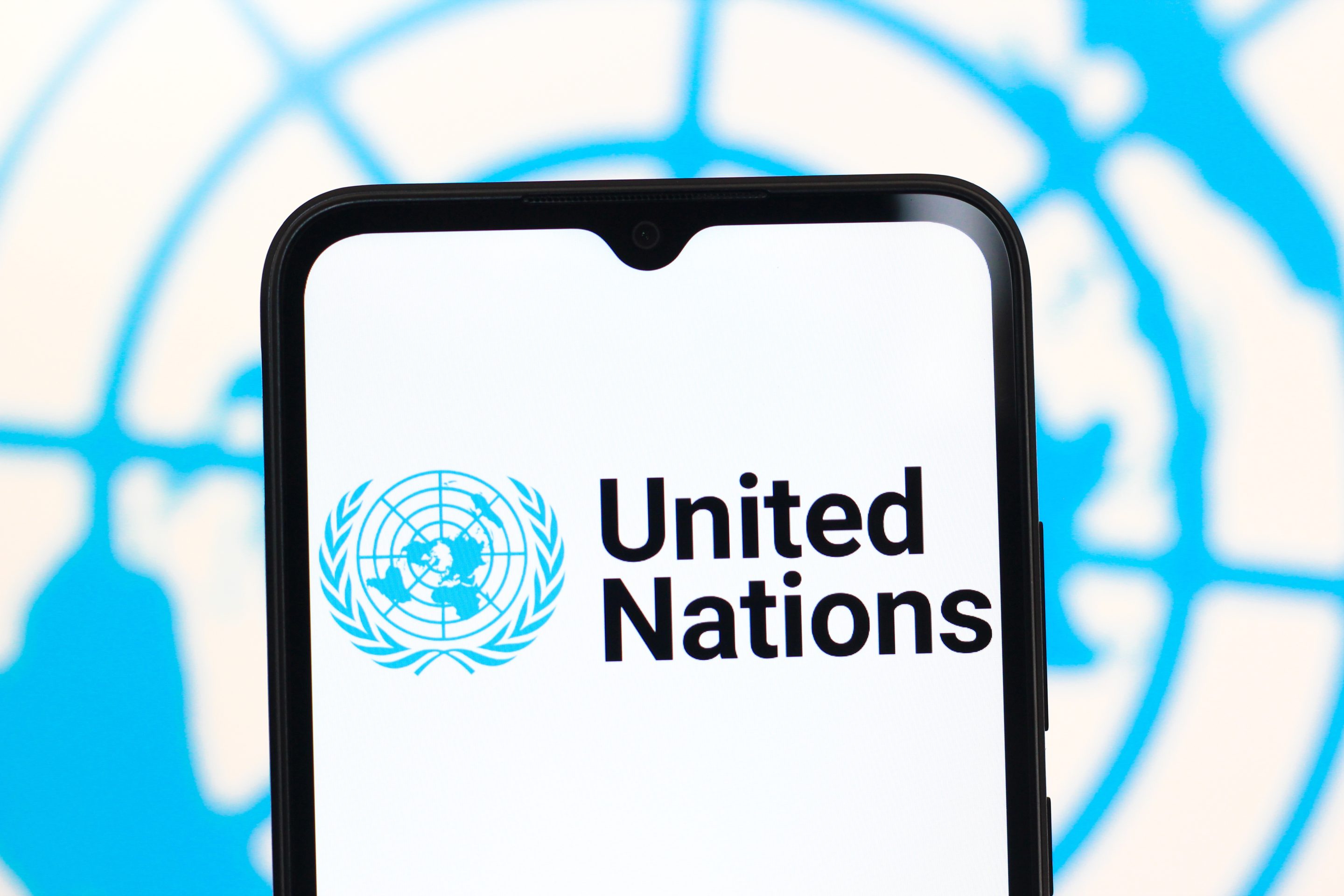 United Nations (UN) logo is seen displayed on a smartphone screen