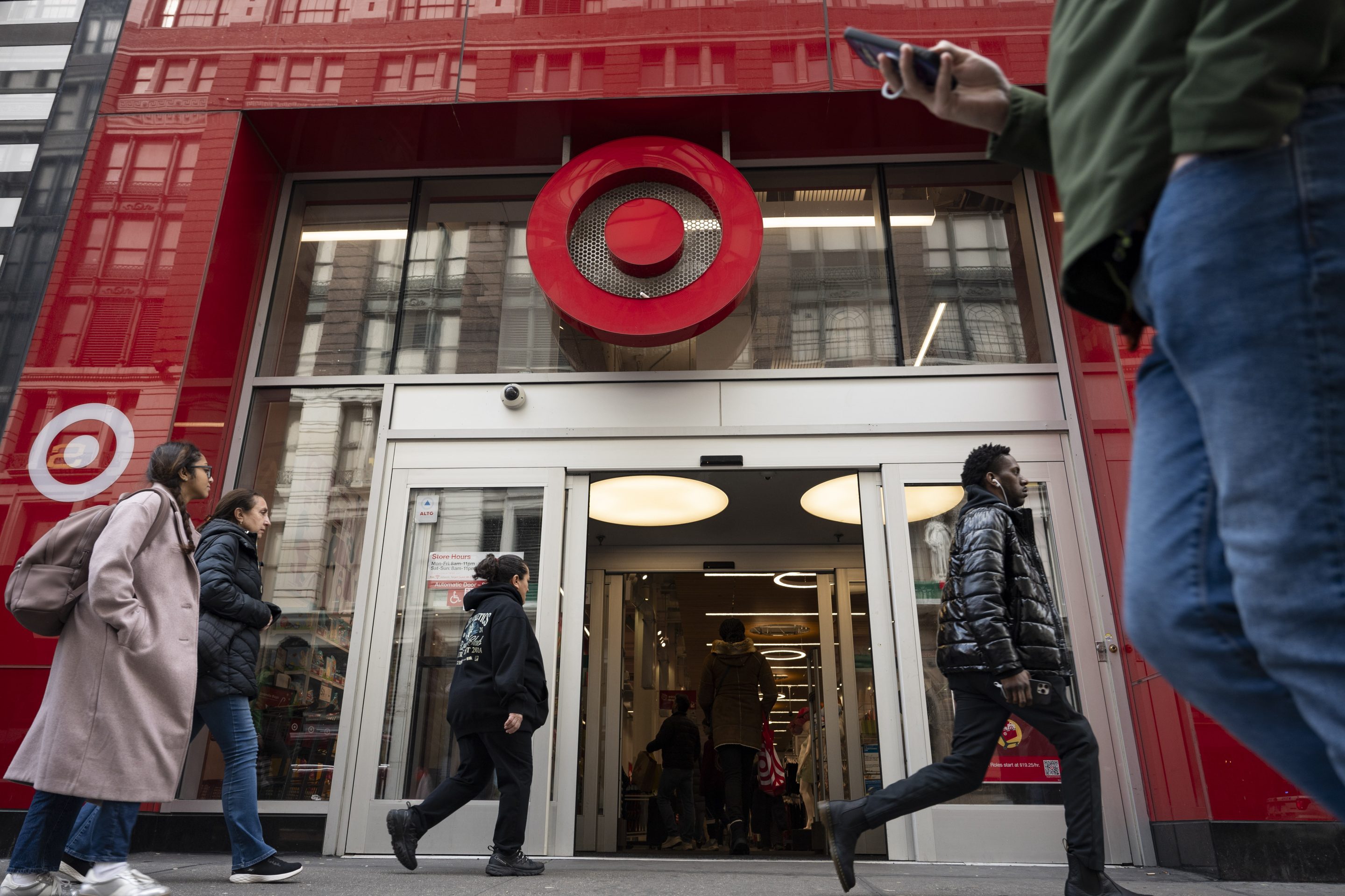 people walking past target store