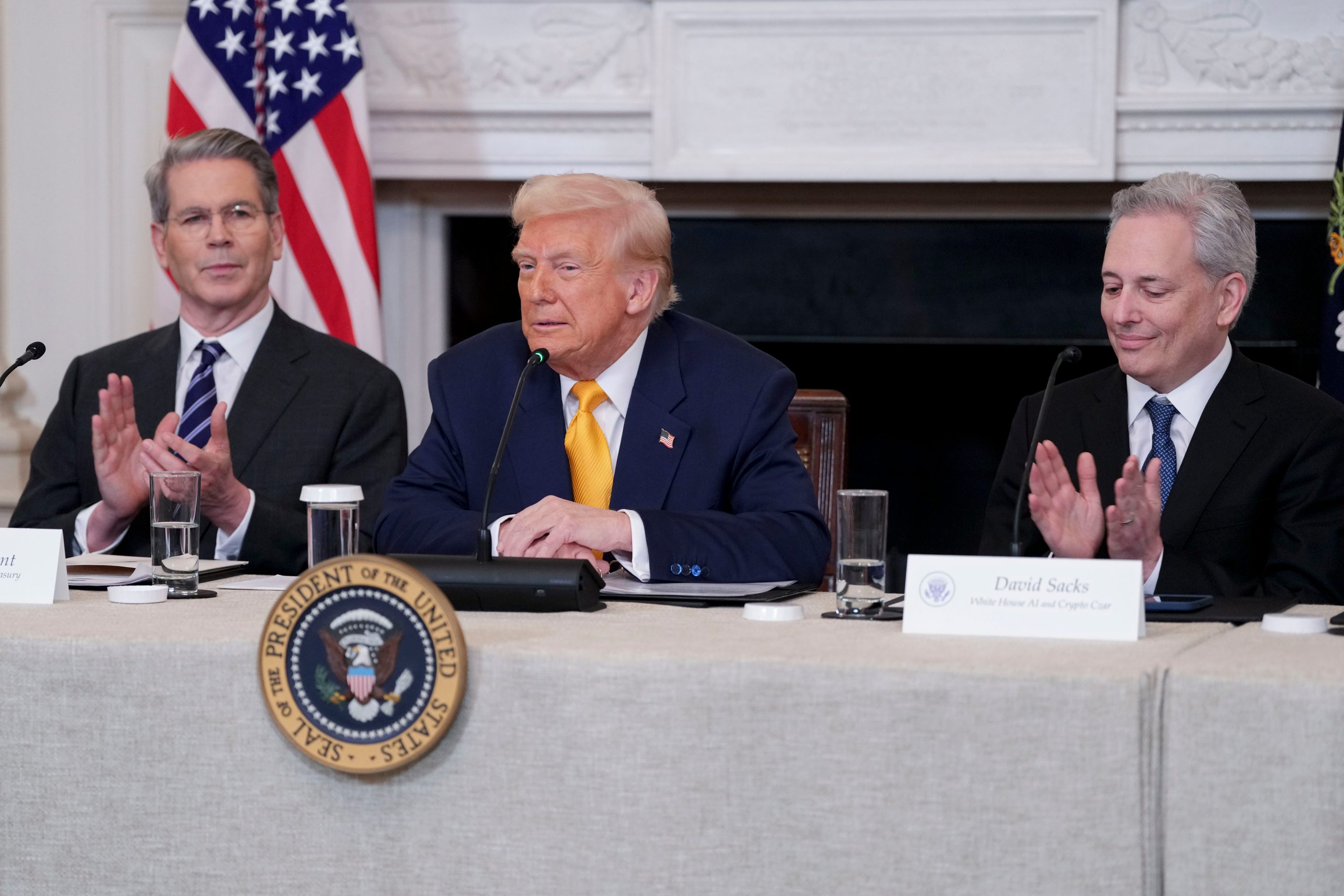 Scott Bessent, Donald Trump, and David Sacks during the White House digital assets summit.