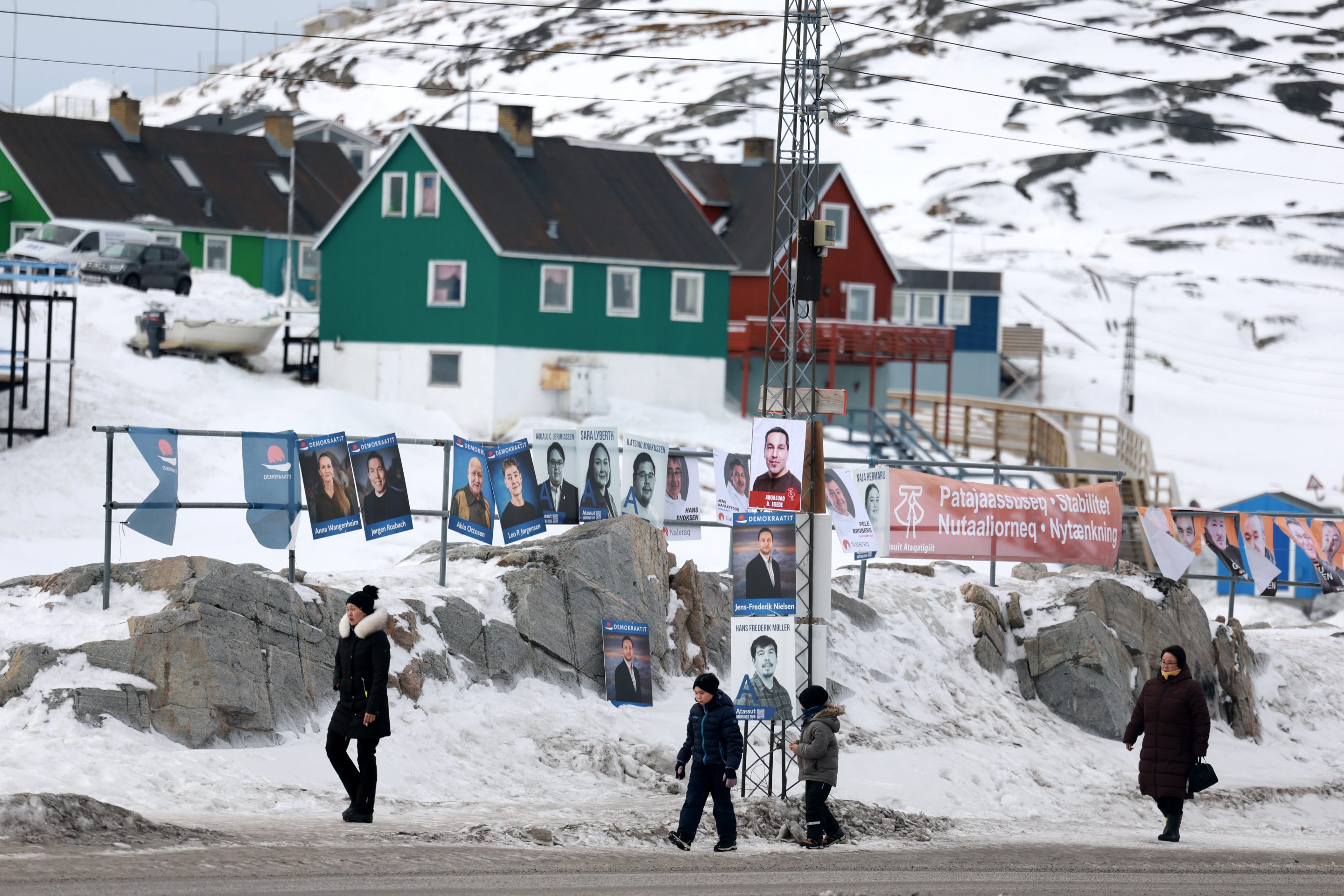 Campaign posters hang outside of the polling station ahead of tomorrow's general election on March 10, 2025 in Ilulissat, Greenland. 