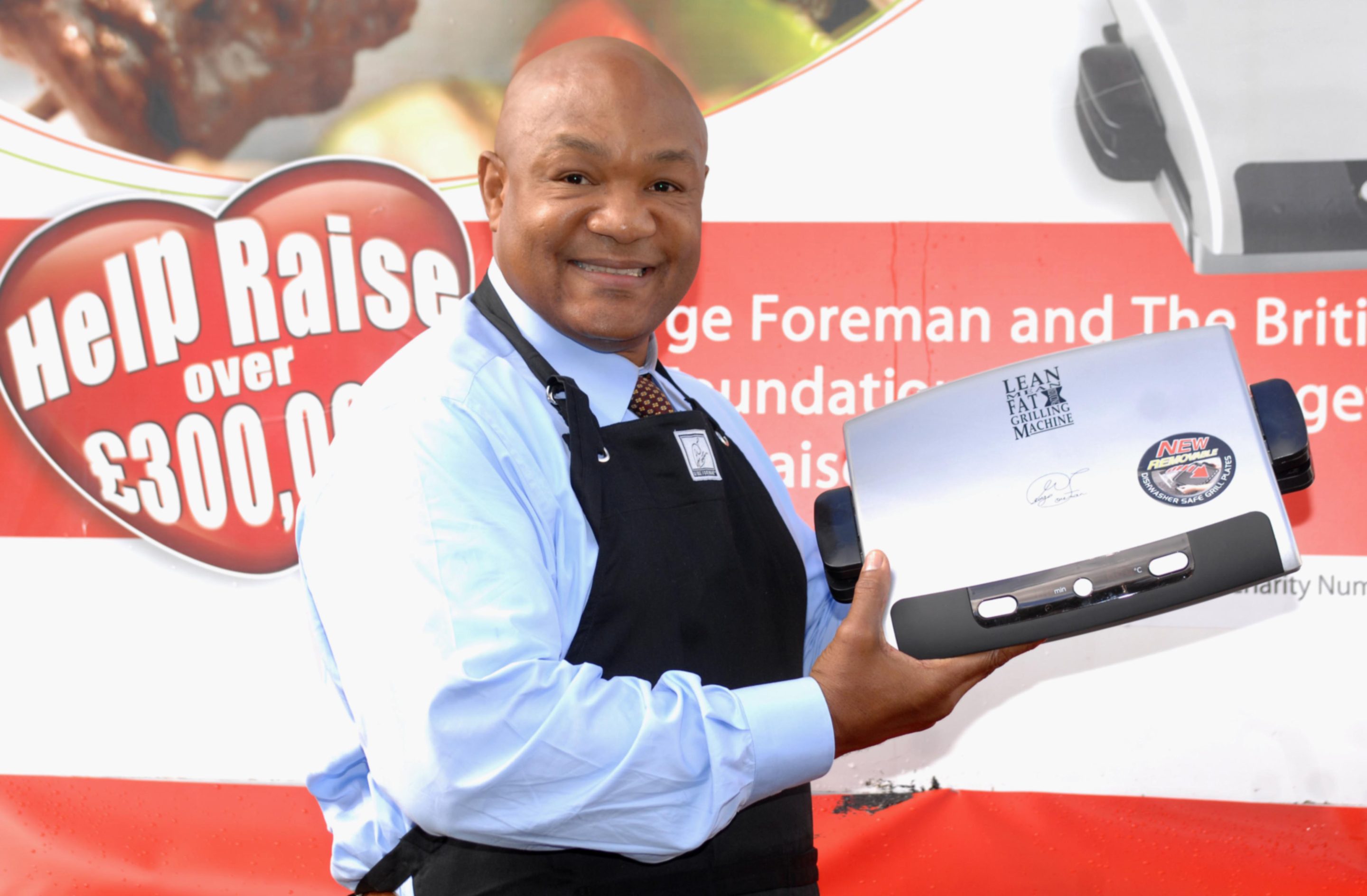 George Foreman demonstrates his grill at Trafalgar Square in London in 2006.