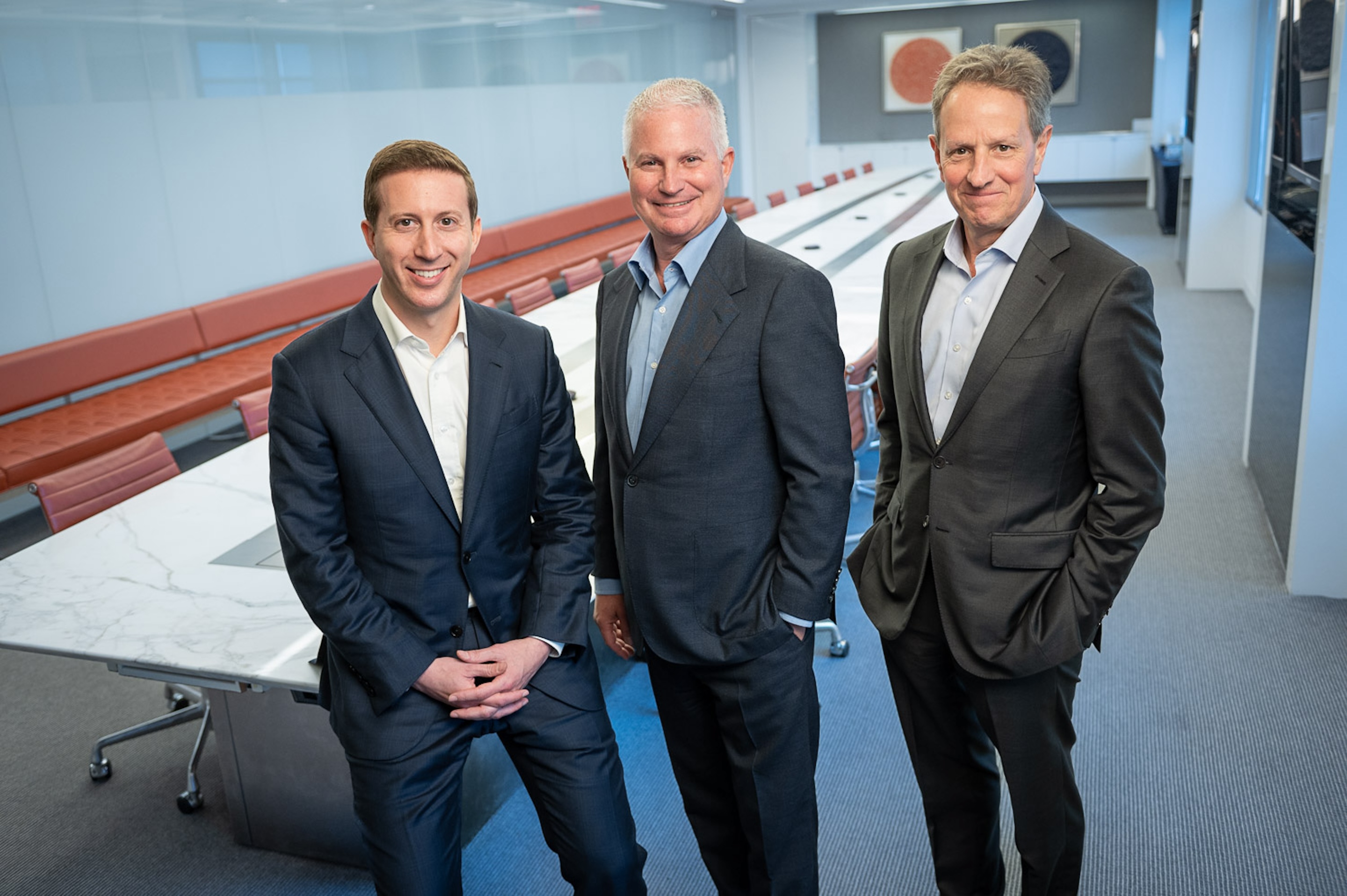 Jeff Perlman, CEO of Warburg, with cochairmen Chip Kaye and Tim Geithner.