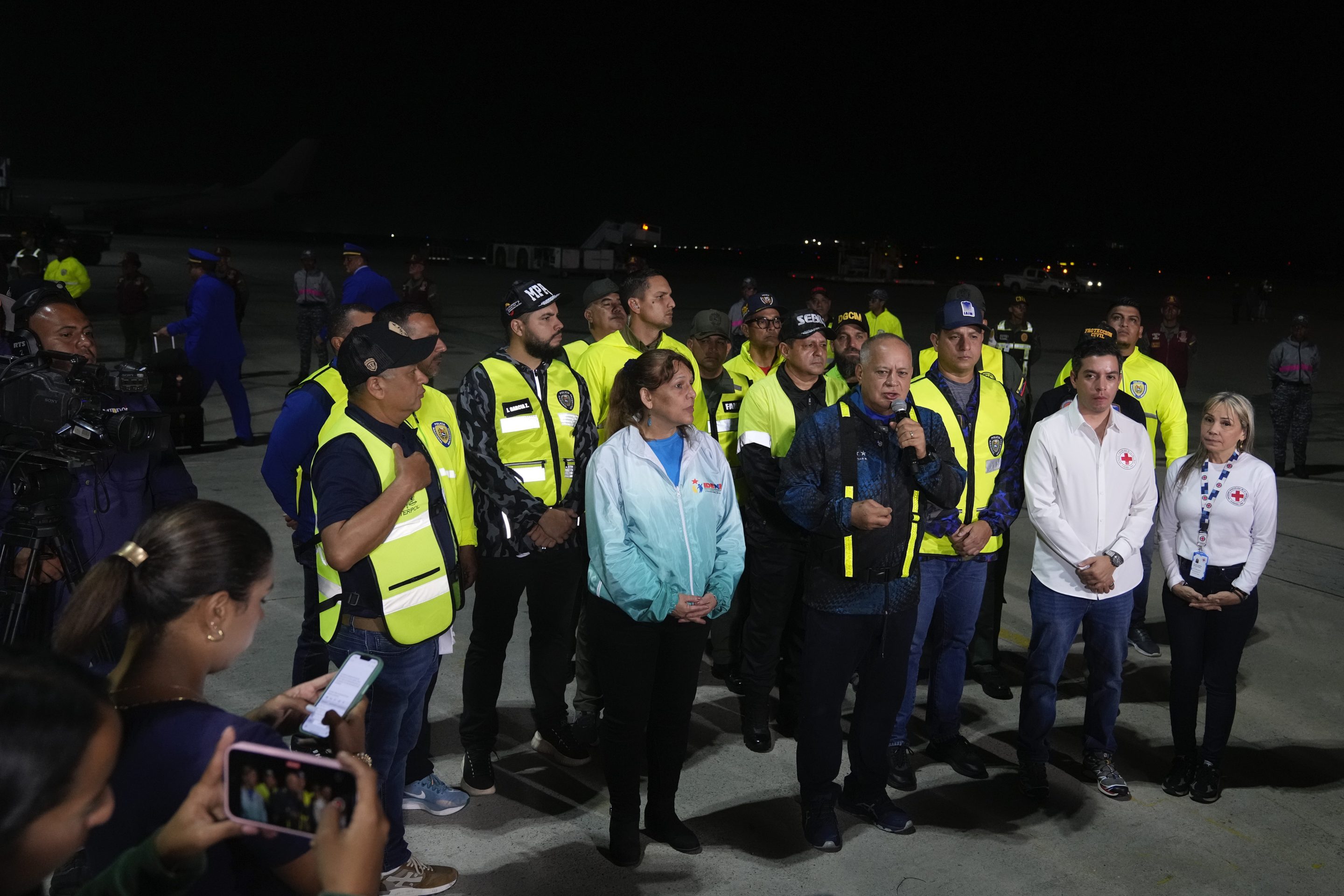 Venezuelan Interior Minister Diosdado Cabello, center, speaks to the press during the arrival of Venezuelan migrants deported from the United States at Simon Bolivar International Airport in Maiquetia, Venezuela, on March 24, 2025. 
