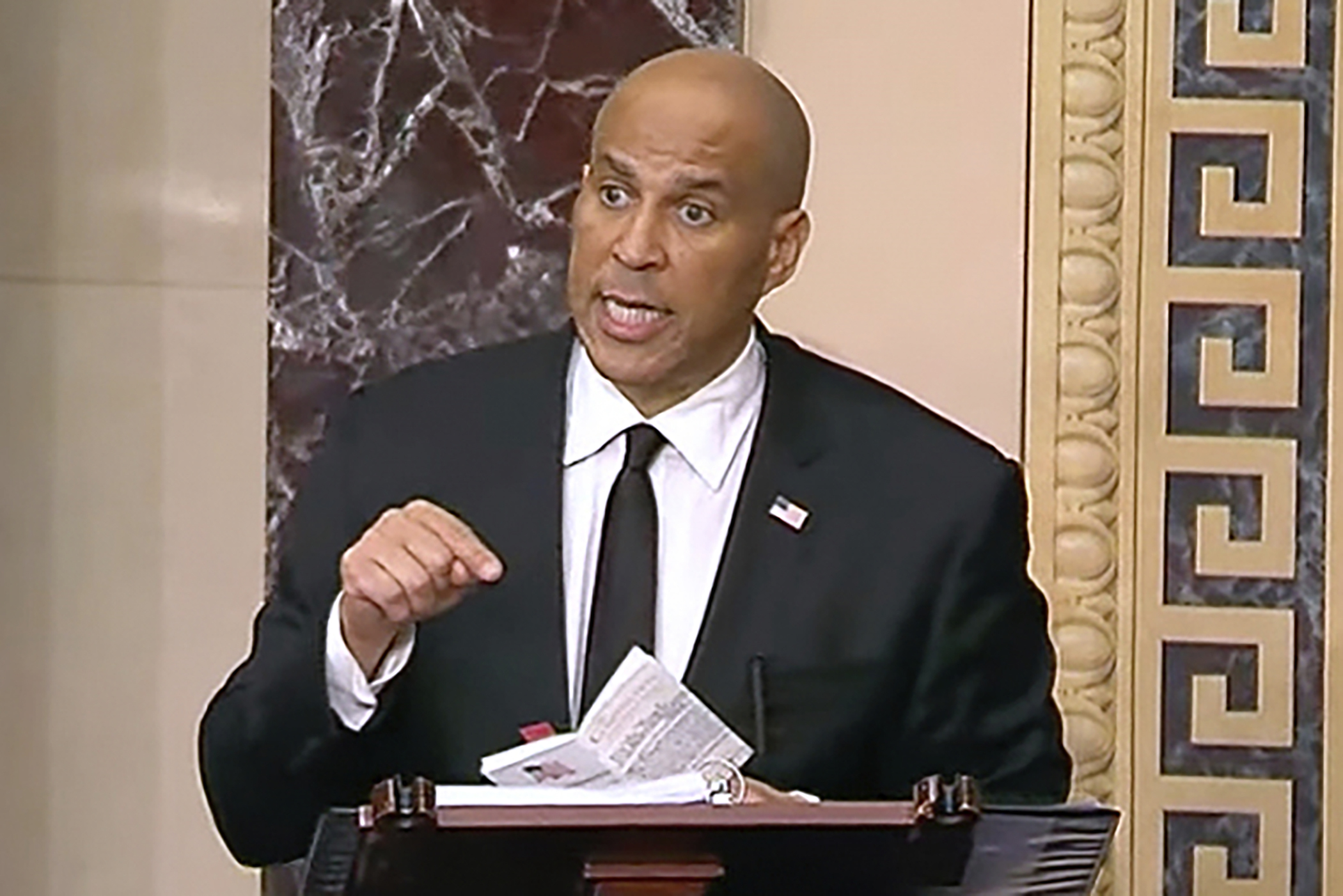 Cory Booker stands on the Senate floor
