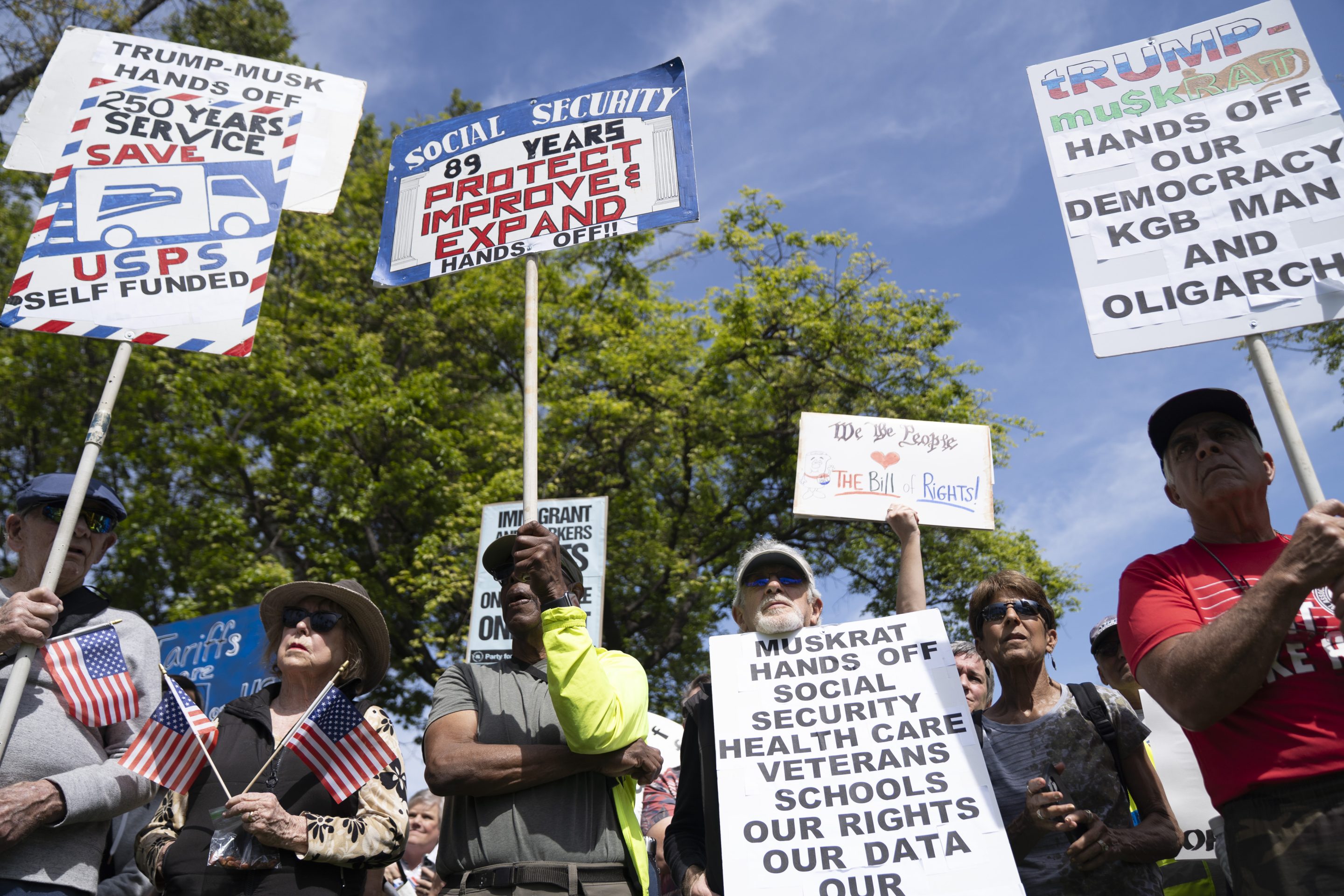 Demonstrators rally against President Donald Trump and Tesla CEO Elon Musk in San Jose, Calif., as part of a national day of action on on April 5, 2025. 
