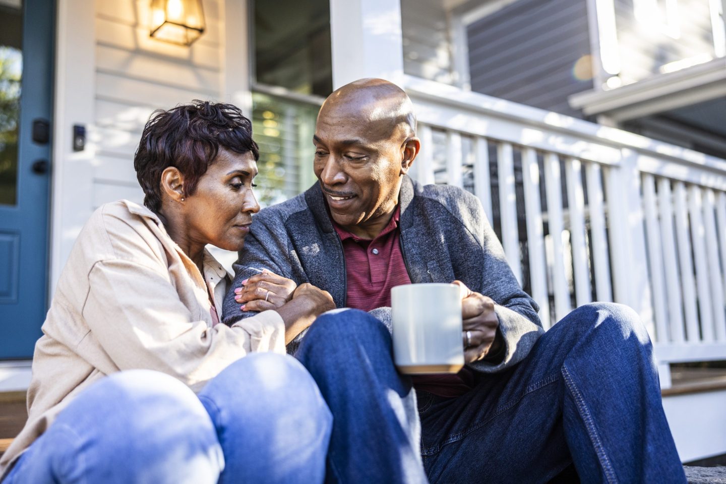 Senior couple having coffee together on their porch
