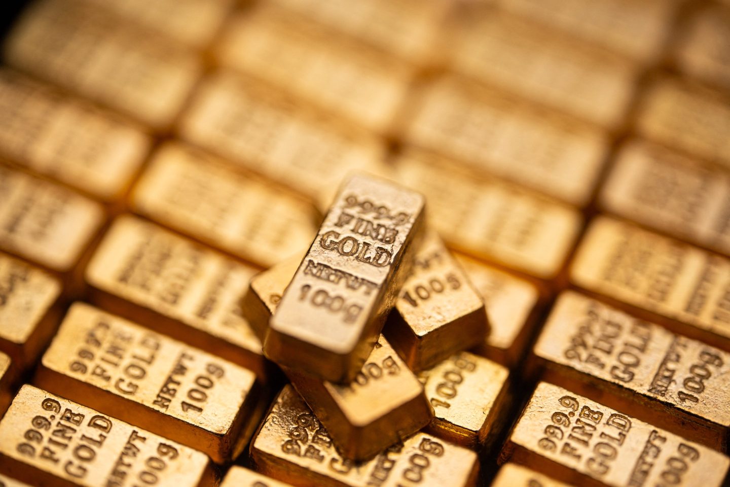 Fake gold bars stacked on top of others