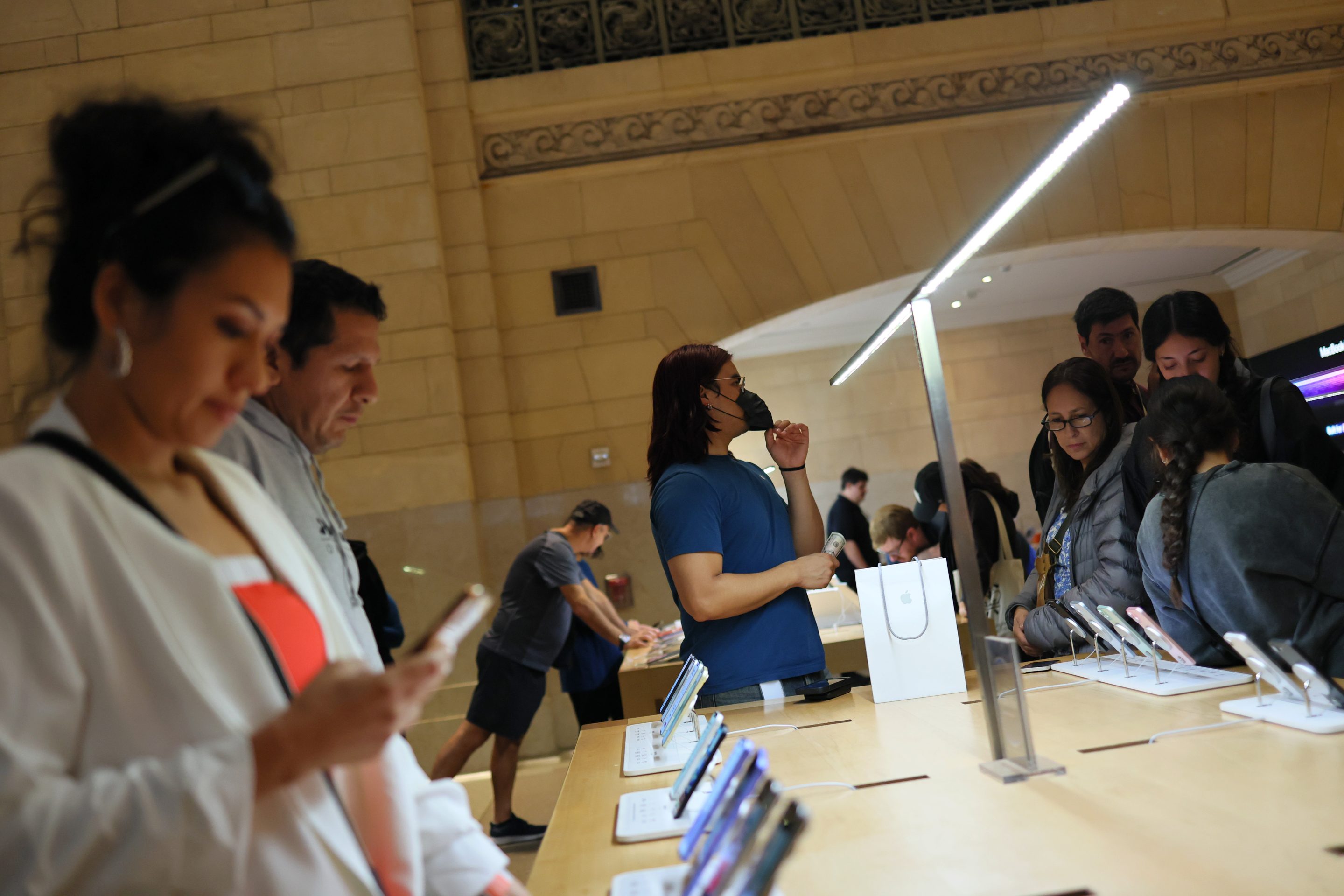 People shop at an Apple store in Grand Central Station on April 4, 2025 in New York City.