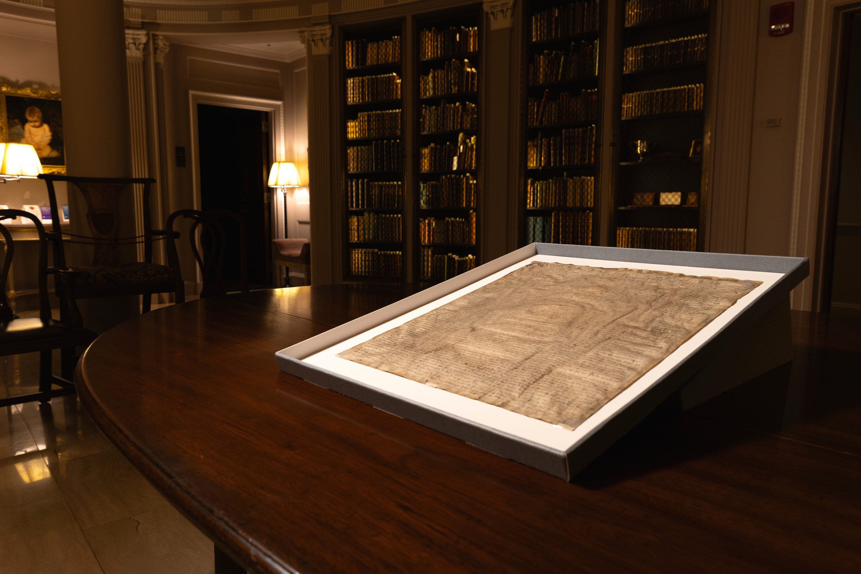 A rare copy of the Magna Carta from 1300 sits in a display case on April 15, 2025, at Harvard Law School in Cambridge, Mass.