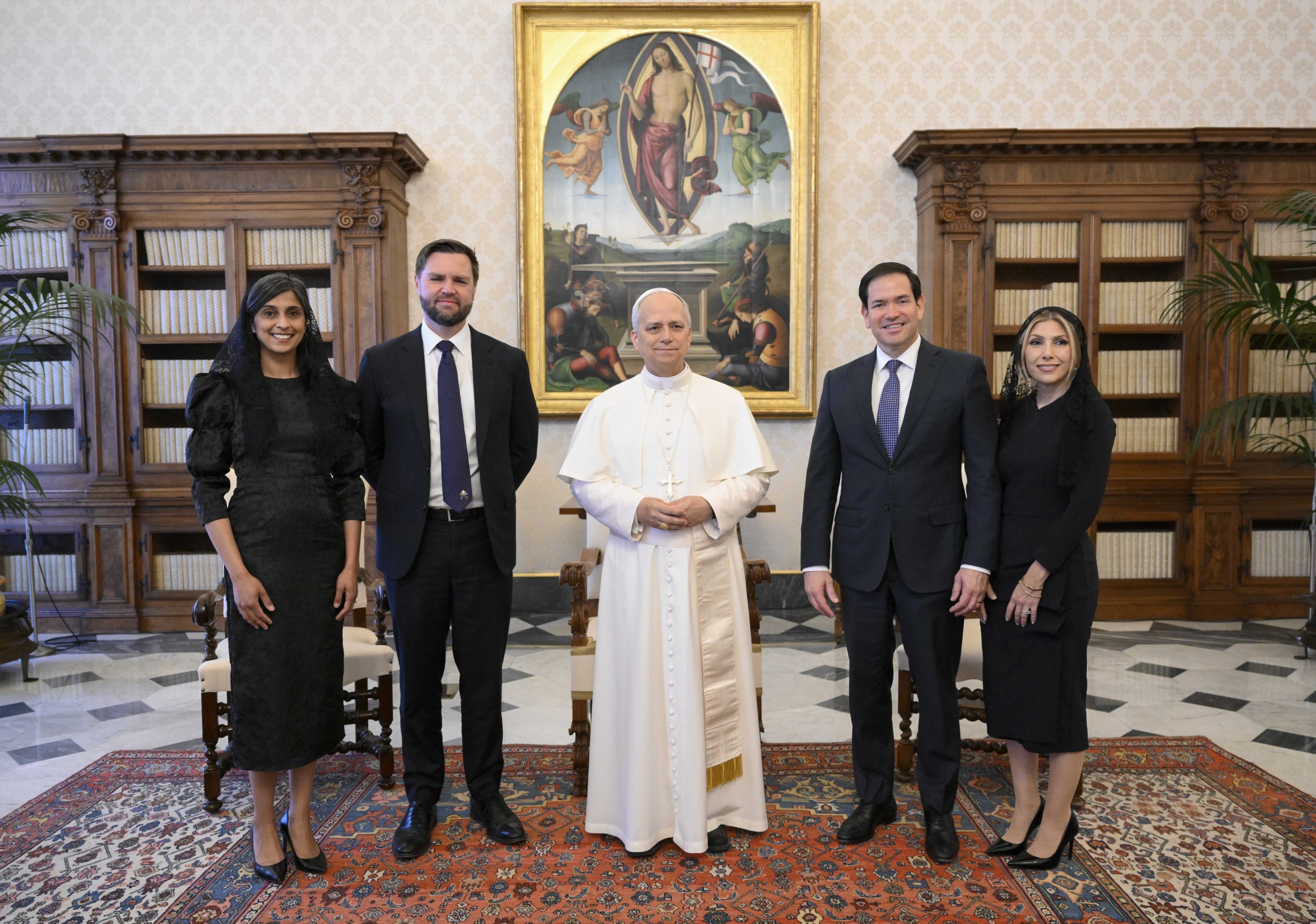 Pope Leo XIV stands for a family photo with Vice President JD Vance, second from left, his wife Usha Vance, Secretary of State Marco Rubio, second from right, and his wife Jeanette Dousdebes Rubio, on the occasion of their meeting at the Vatican, on May 19, 2025.