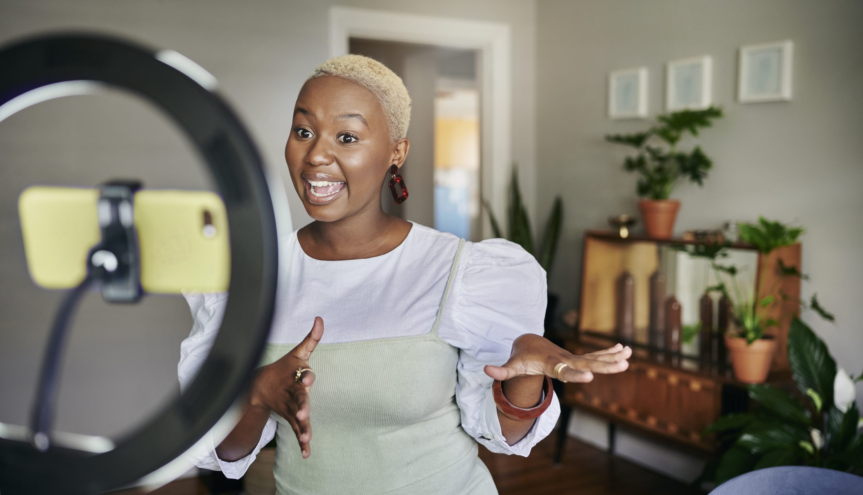 Influencer standing in front of a tripod