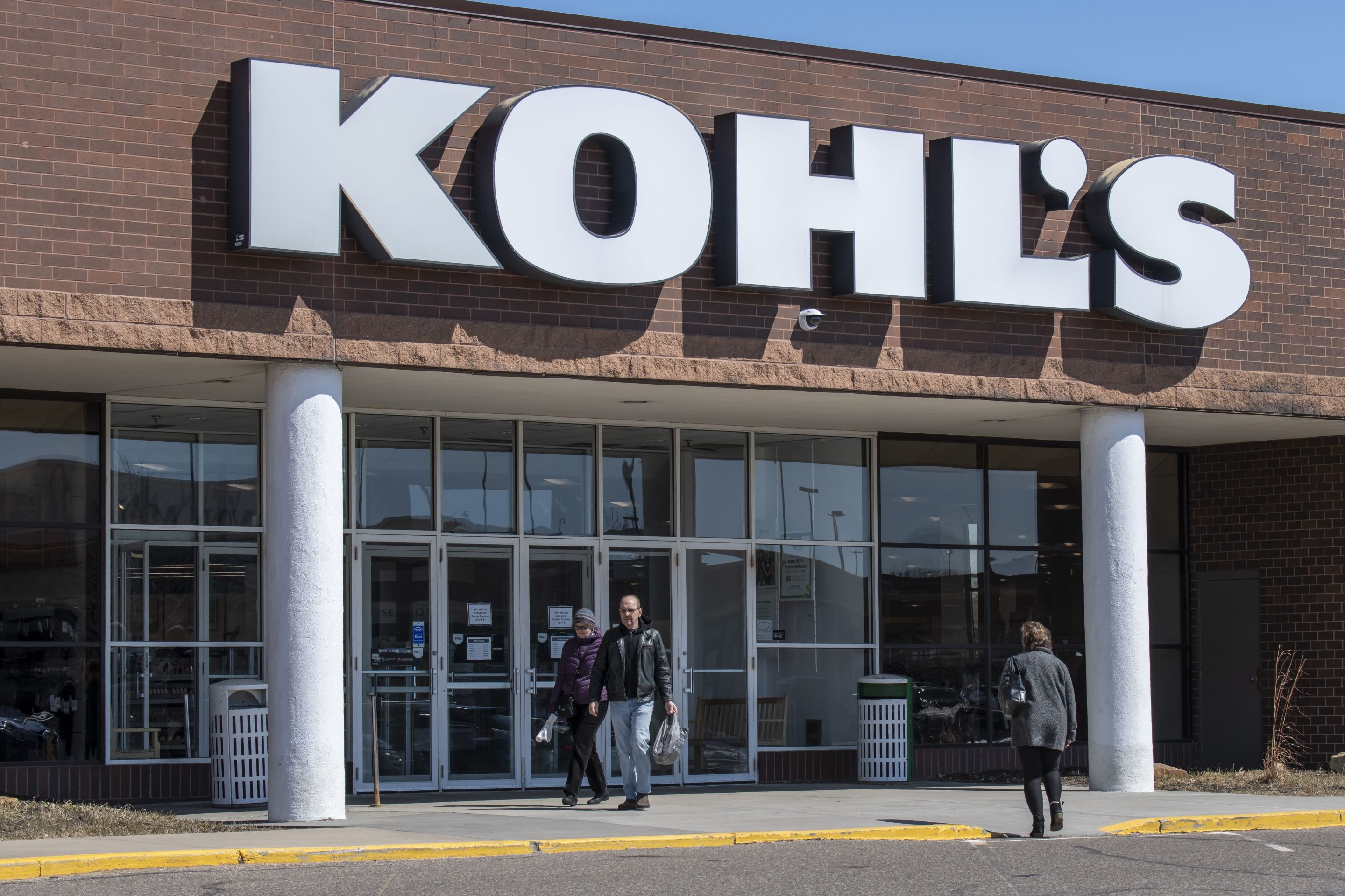 customers walking into and out of Kohl's store