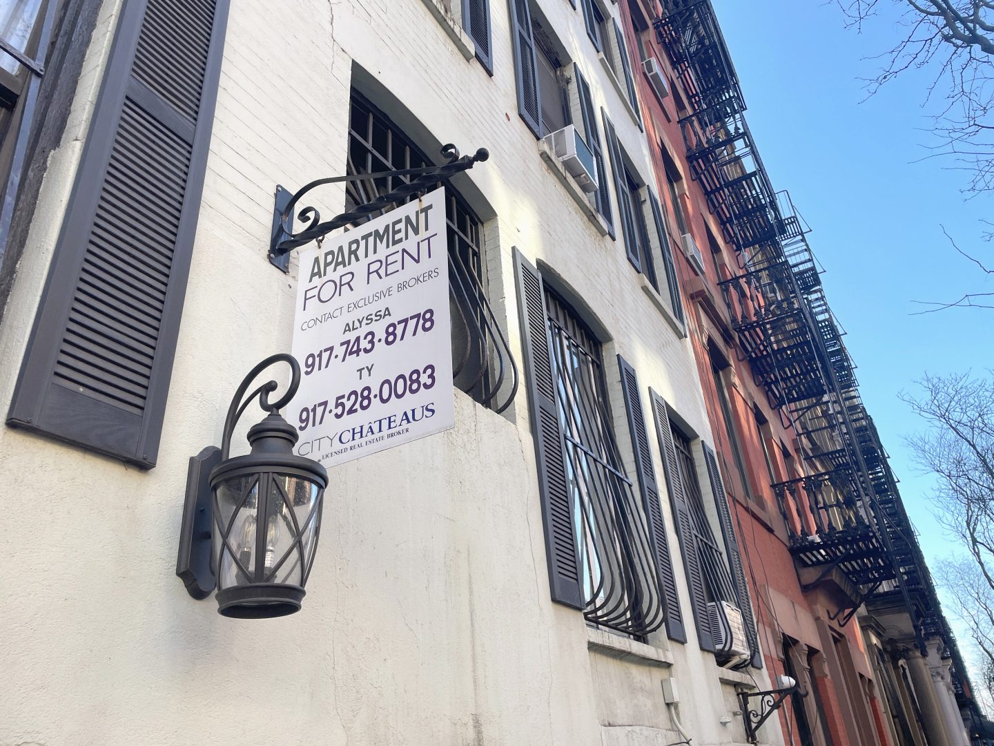 A 'For Rent' sign on a Hell's Kitchen, New York City apartment building
