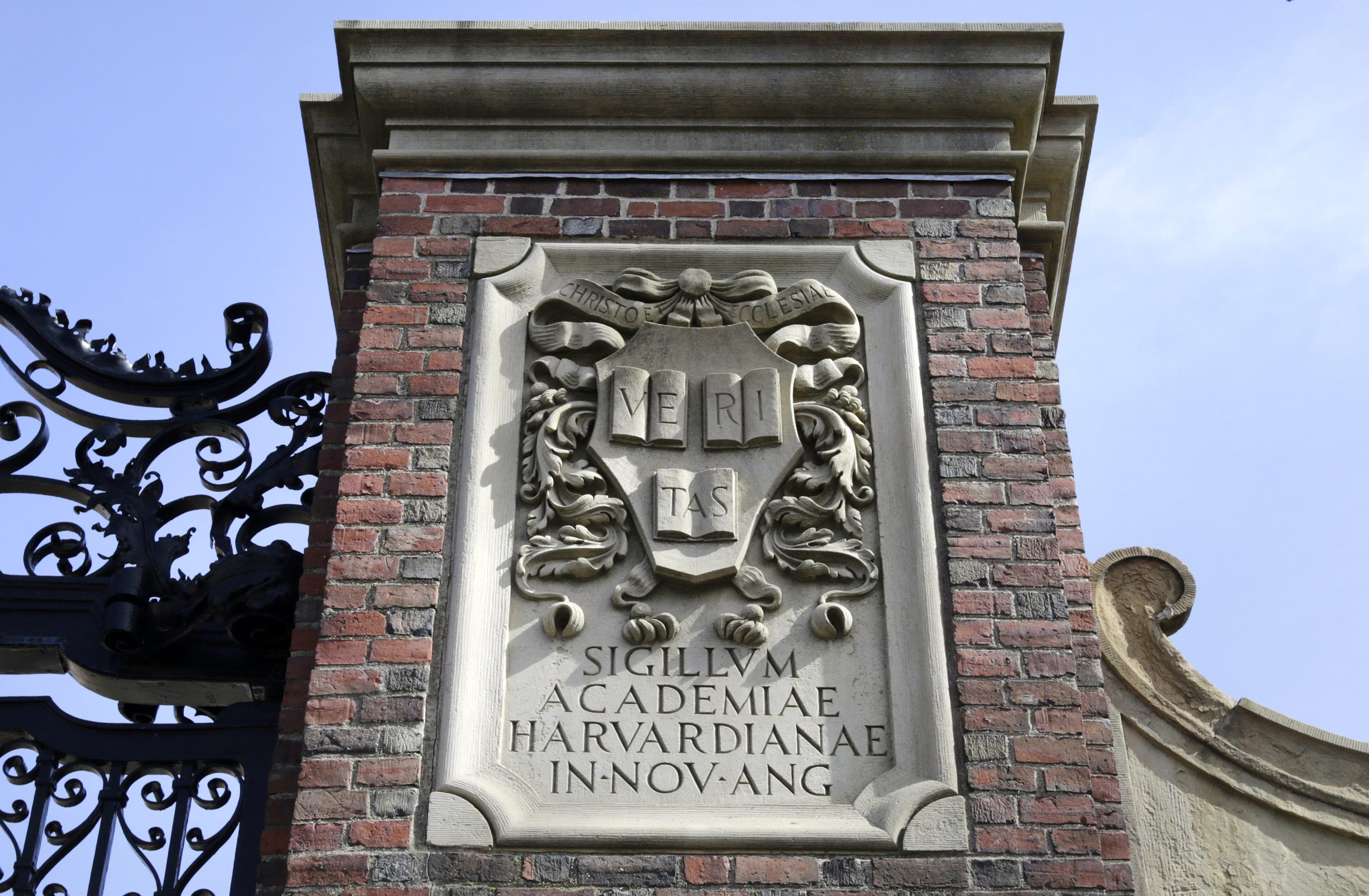 A relief sculpture rests on a gate to the entrance of Harvard University, in Cambridge, Mass., March 13, 2016. 