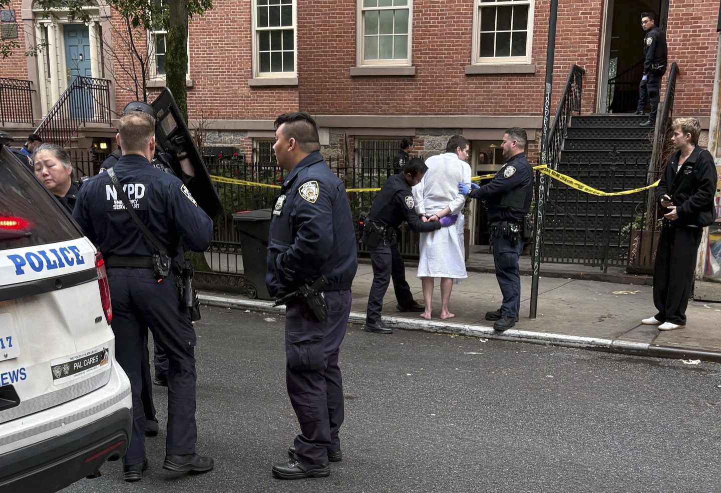 New York police officers arrest John Woeltz, on May 23, 2025, in New York, who was charged with kidnapping, assaulting and holding a man against his will for several weeks in an upscale Manhattan townhouse.
