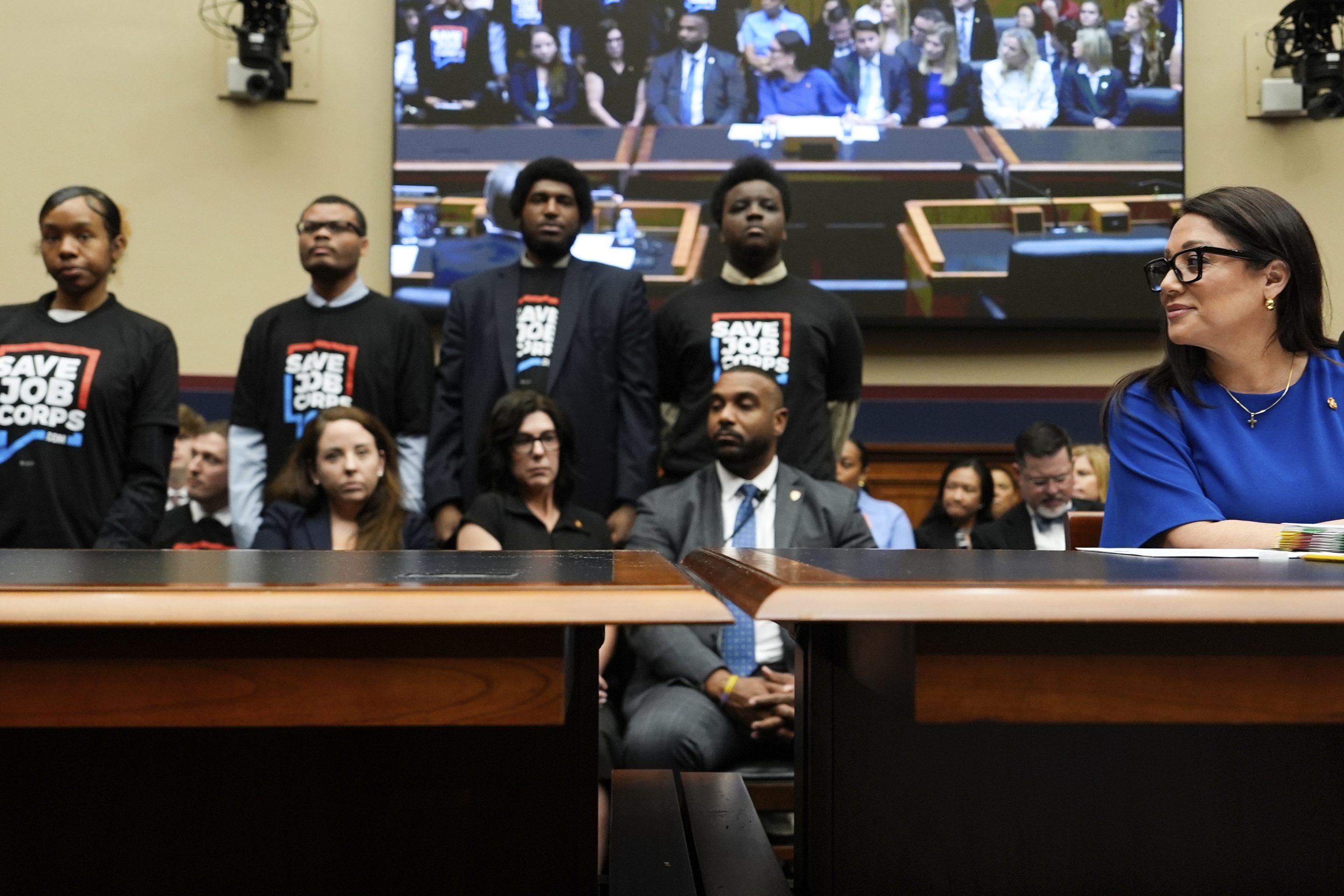 Secretary of Labor Lori Chavez-DeRemer looks as Job Corps members stand behind her during a House Education and Workforce hearing, on June 5, 2025, on Capitol Hill in Washington.