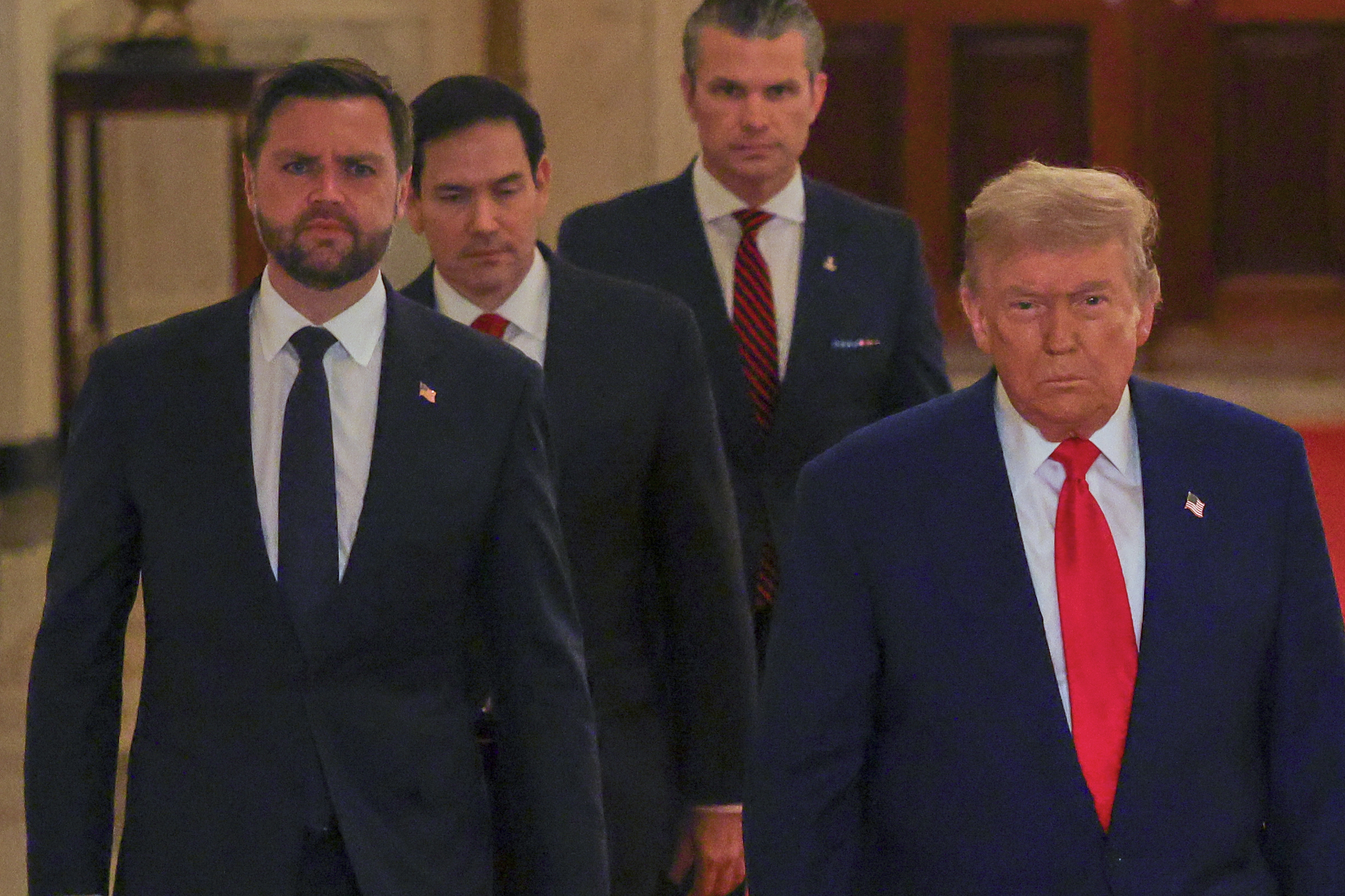President Donald Trump arrives with Vice President JD Vance, Secretary of State Marco Rubio and Defense Secretary Pete Hegseth to speak from the East Room of the White House on Saturday