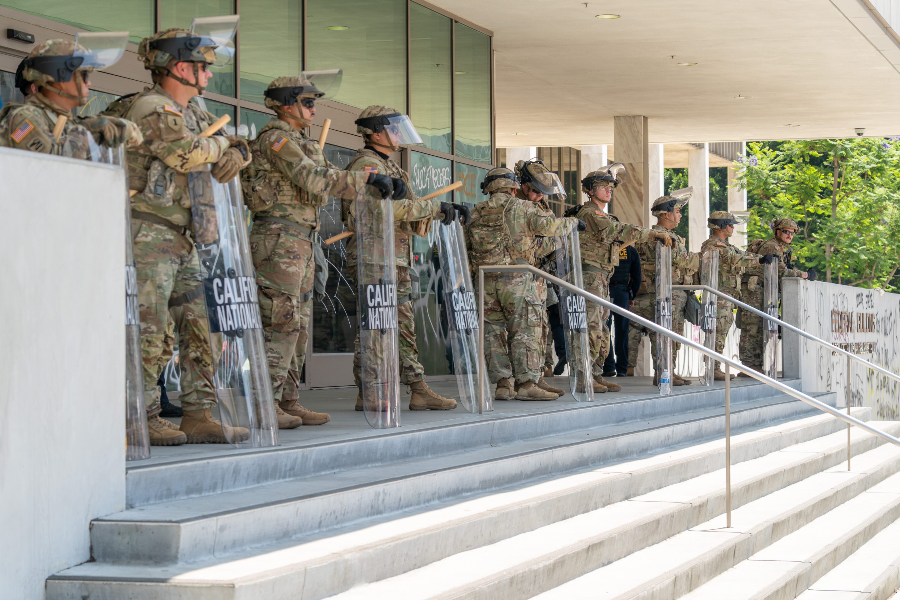 National Guard soldiers stand outside the Edward R. Roybal Federal Building in Los Angeles on Monday.