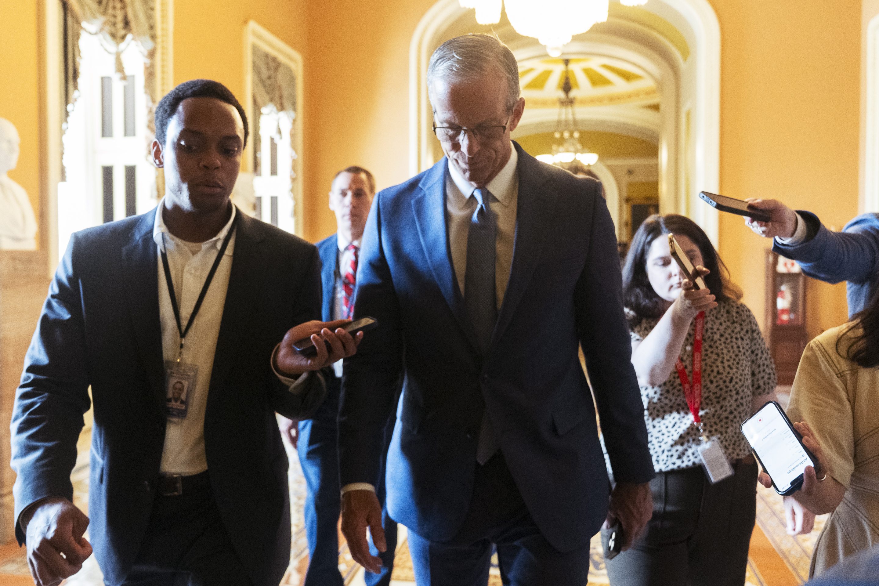 Senate Majority Leader John Thune, R-S.D., is followed by reporters as he walks from the chamber to his office as Republicans begin a final push to advance President Donald Trump's tax breaks and spending cuts package, at the Capitol in Washington, on June 30, 2025.