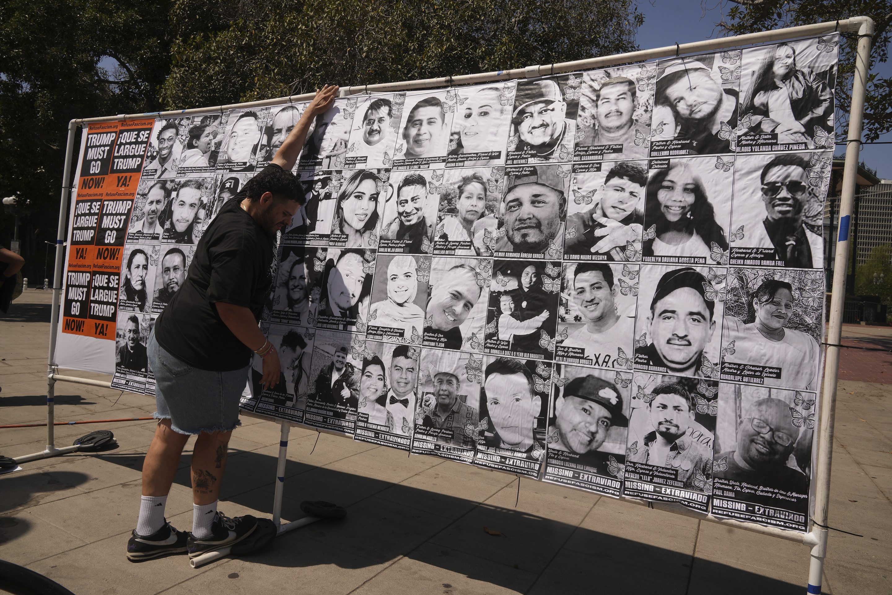 An art installation in Los Angeles displaying names and faces of people who have been detained, deported, or sent to offshore camps during ICE raids in Southern California.