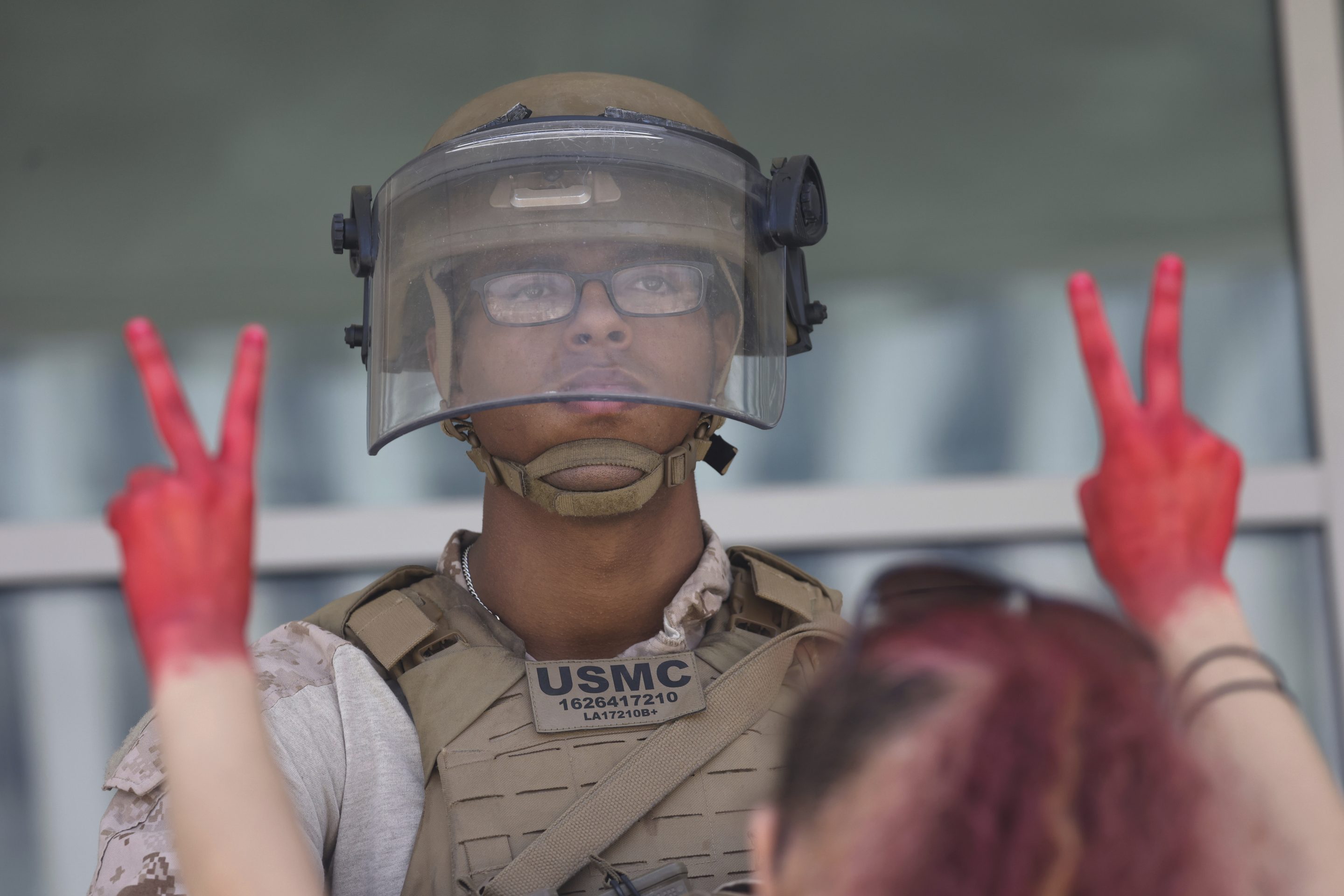 Protesters confront Marines outside the Federal Building on July 4, 2025 in Los Angeles.
