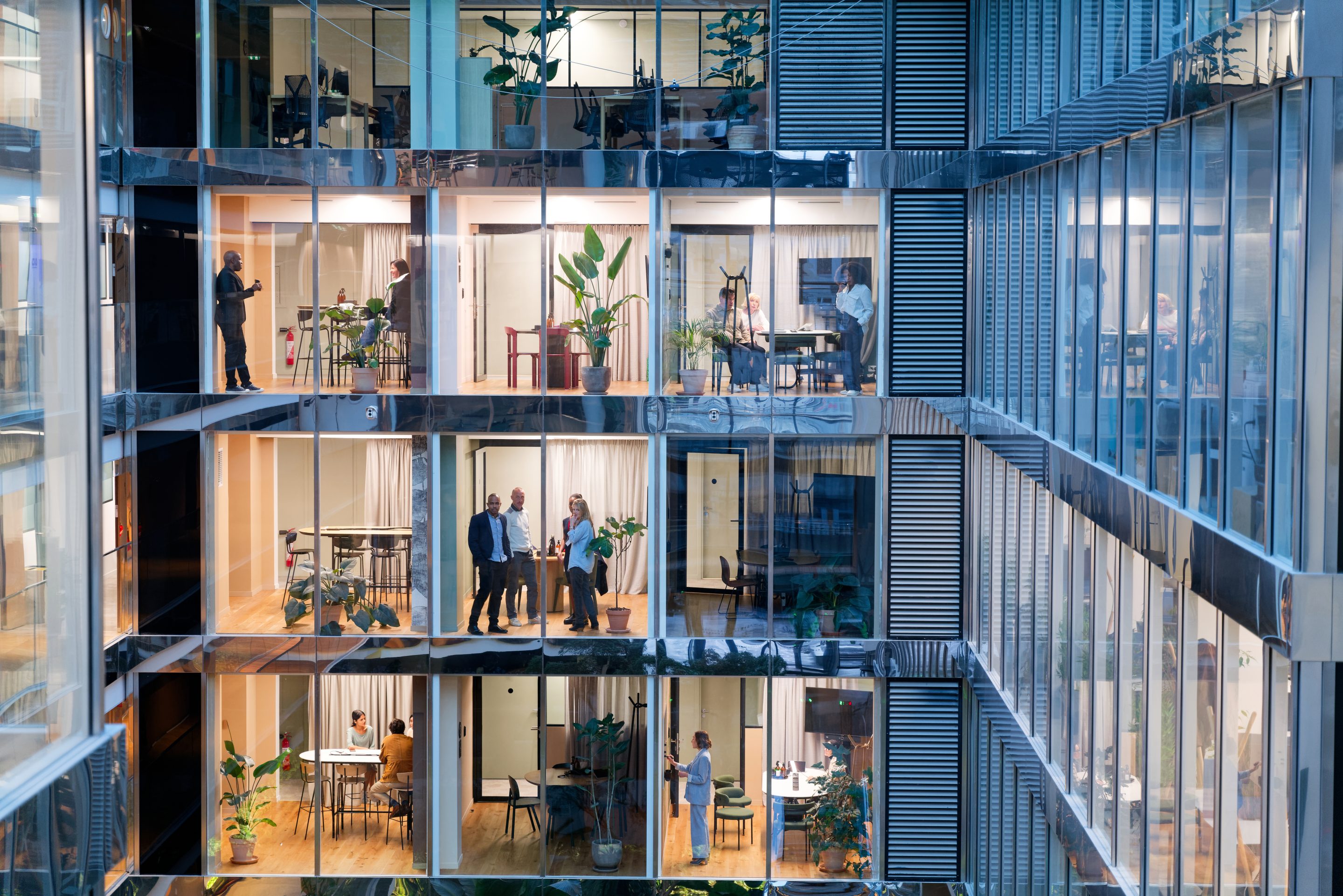 Business people working in several floors of an office building 