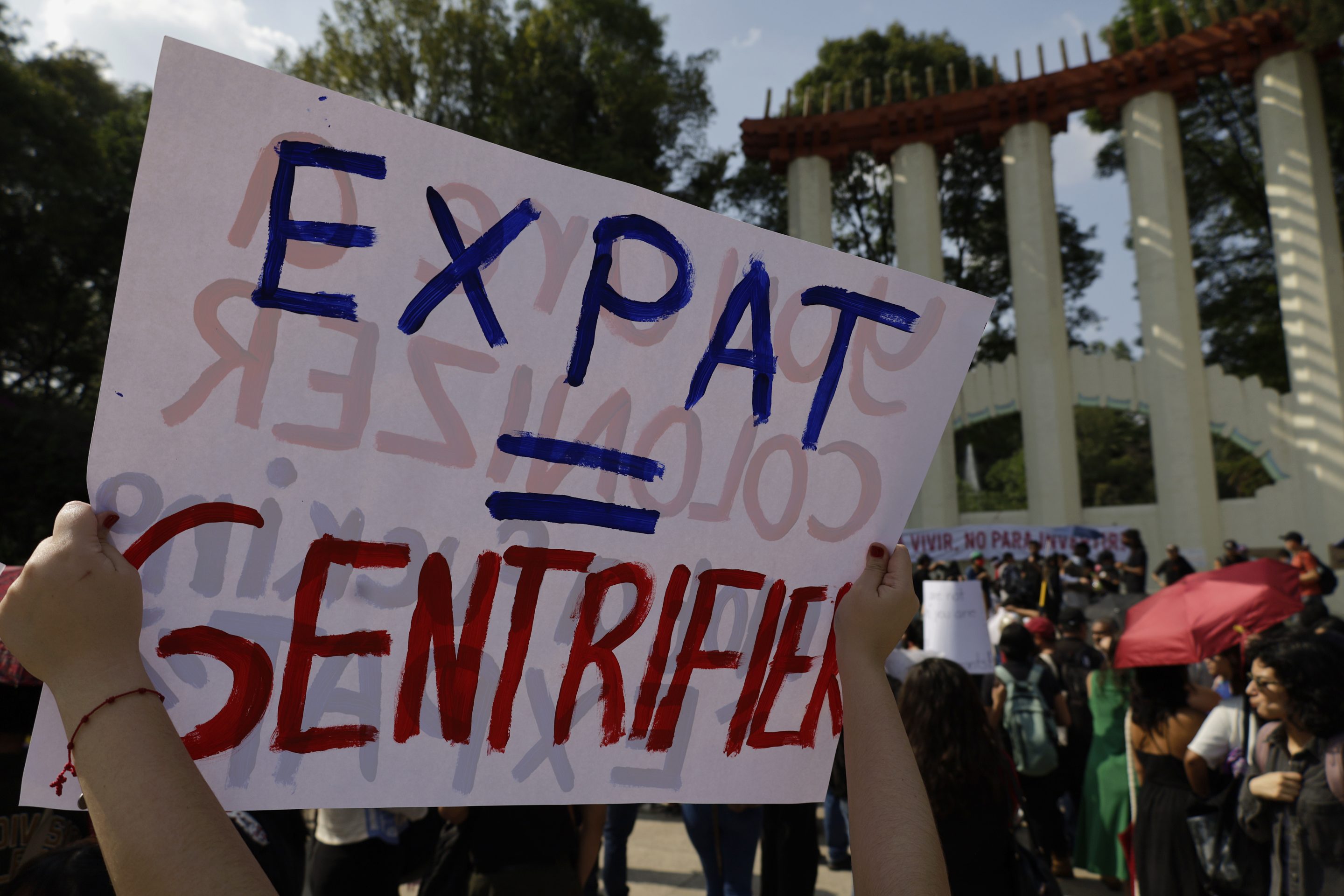 Anti-gentrification collectives in Mexico City hold a protest in Parque Mexico in the Condesa neighborhood, demanding that the capital's authorities halt what they call a new proliferation of foreigners that leaves current and future generations homeless and causes high rents for apartments and houses, on July 4, 2025.