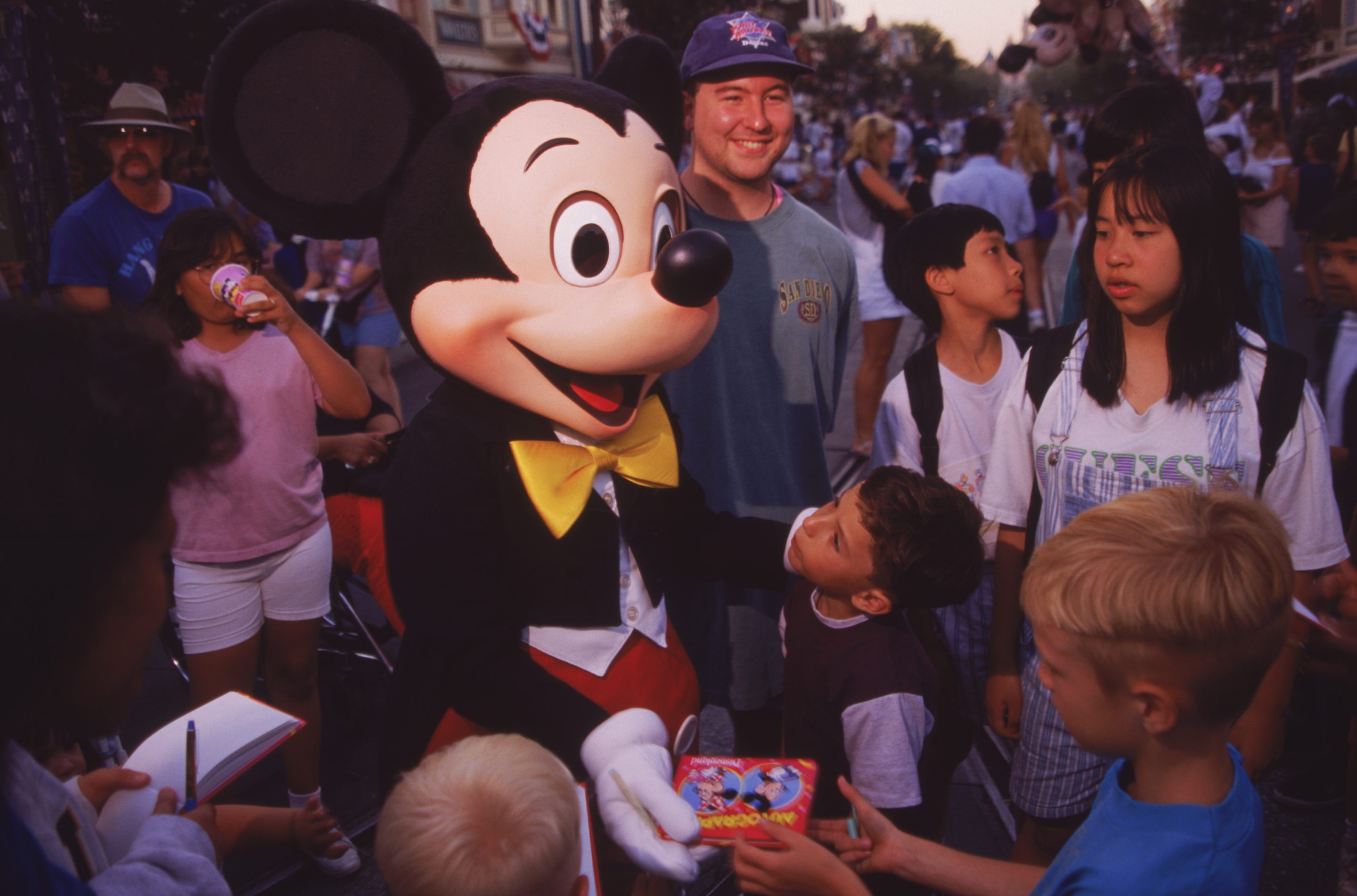 Mickey Mouse entertains children at Disneyland the summer of 1995.