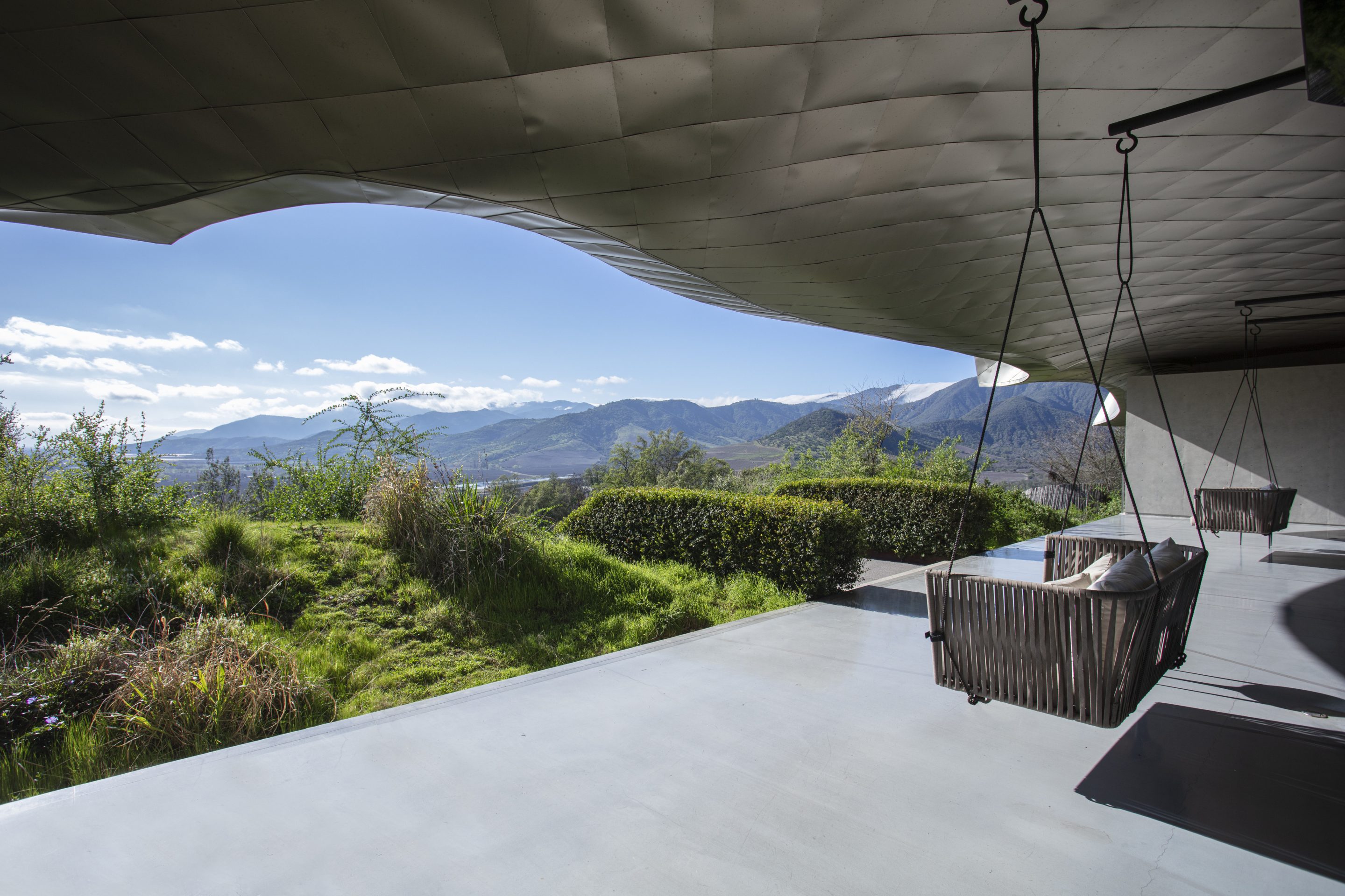 The hotel’s front porch offers sweeping views of the Millahue Valley’s exuberant nature.