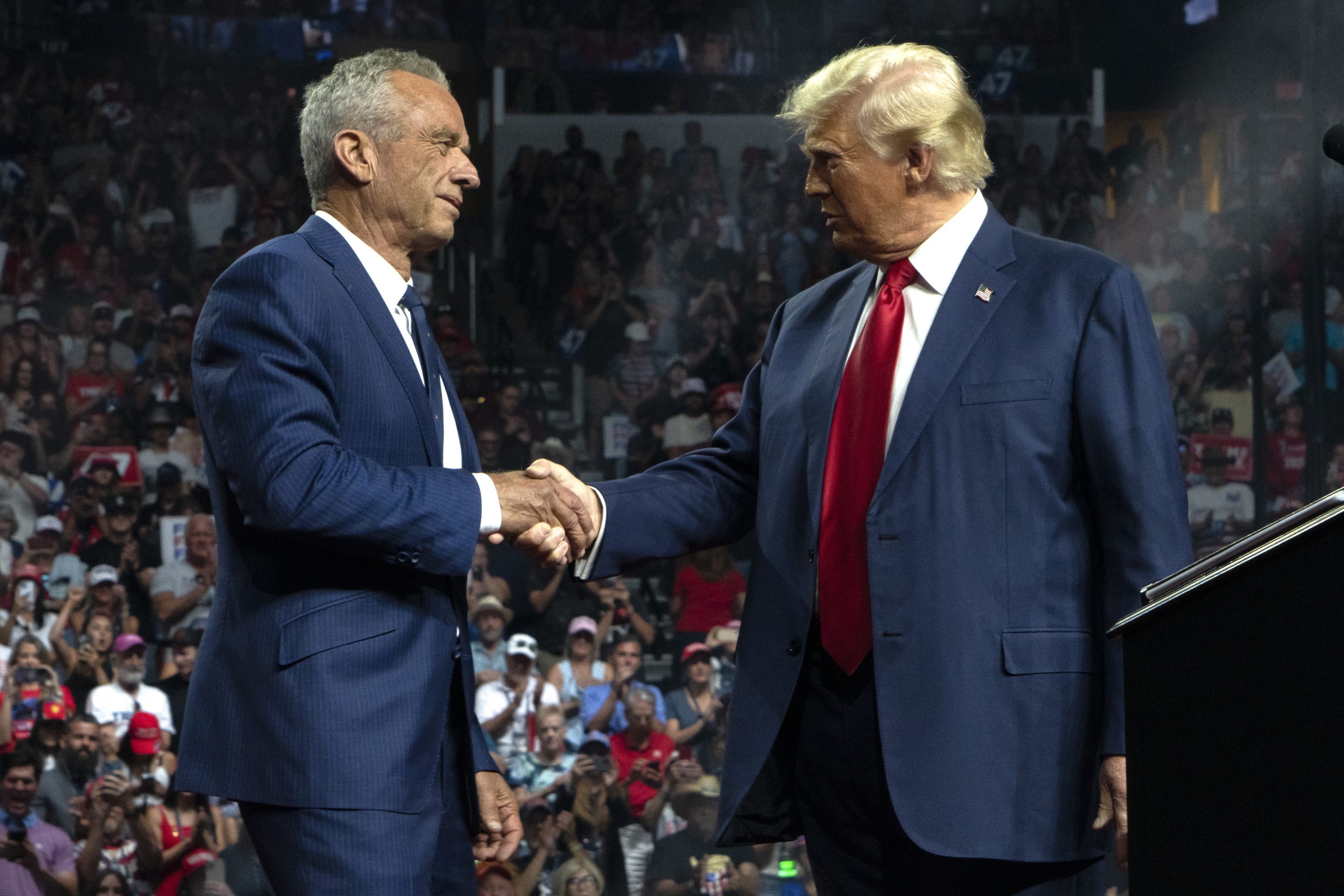 President Donald Trump and Robert F. Kennedy Jr. shake hands during a campaign rally in Glendale, Arizona in 2024.