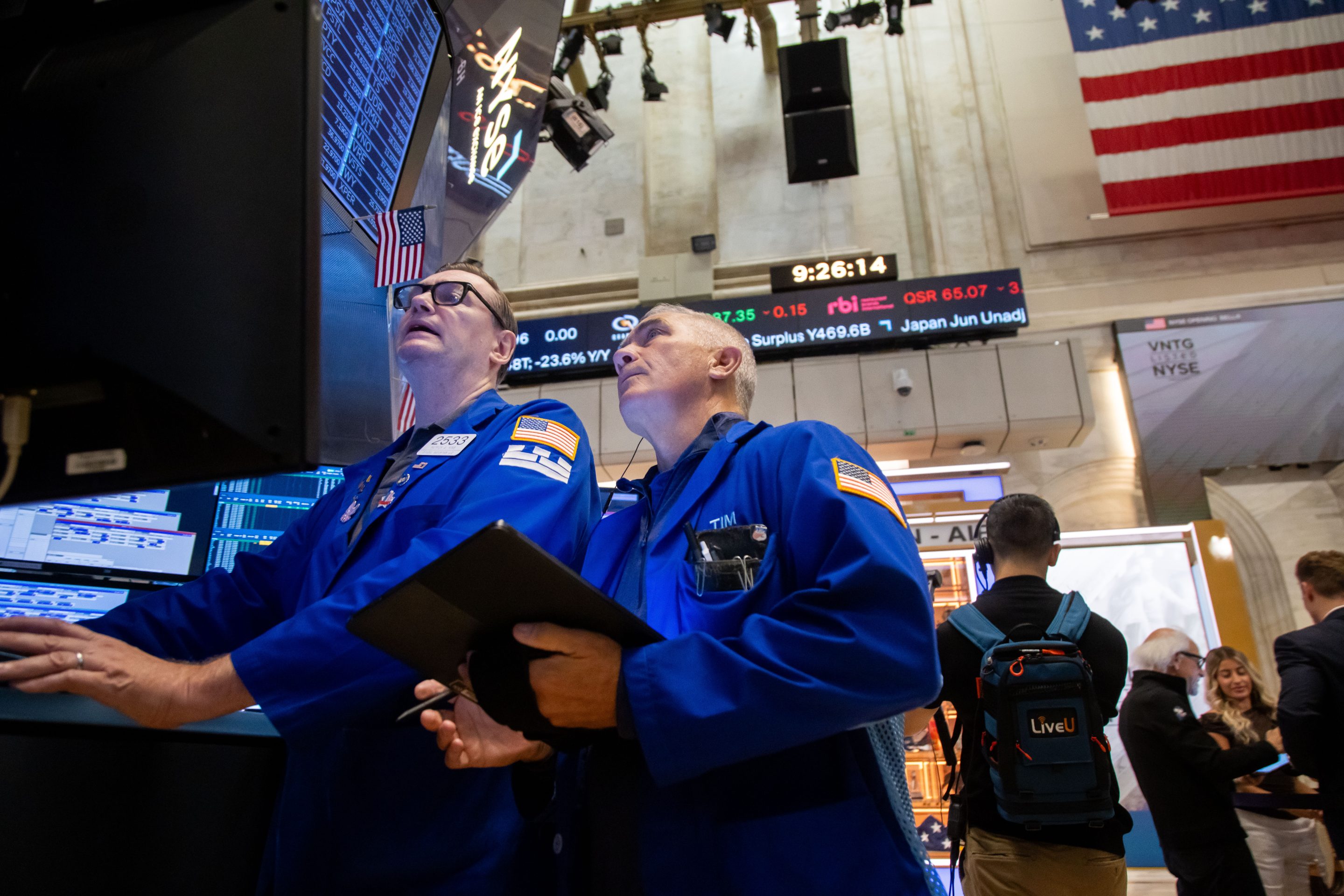 Traders work on the floor at the New York Stock Exchange on Friday.