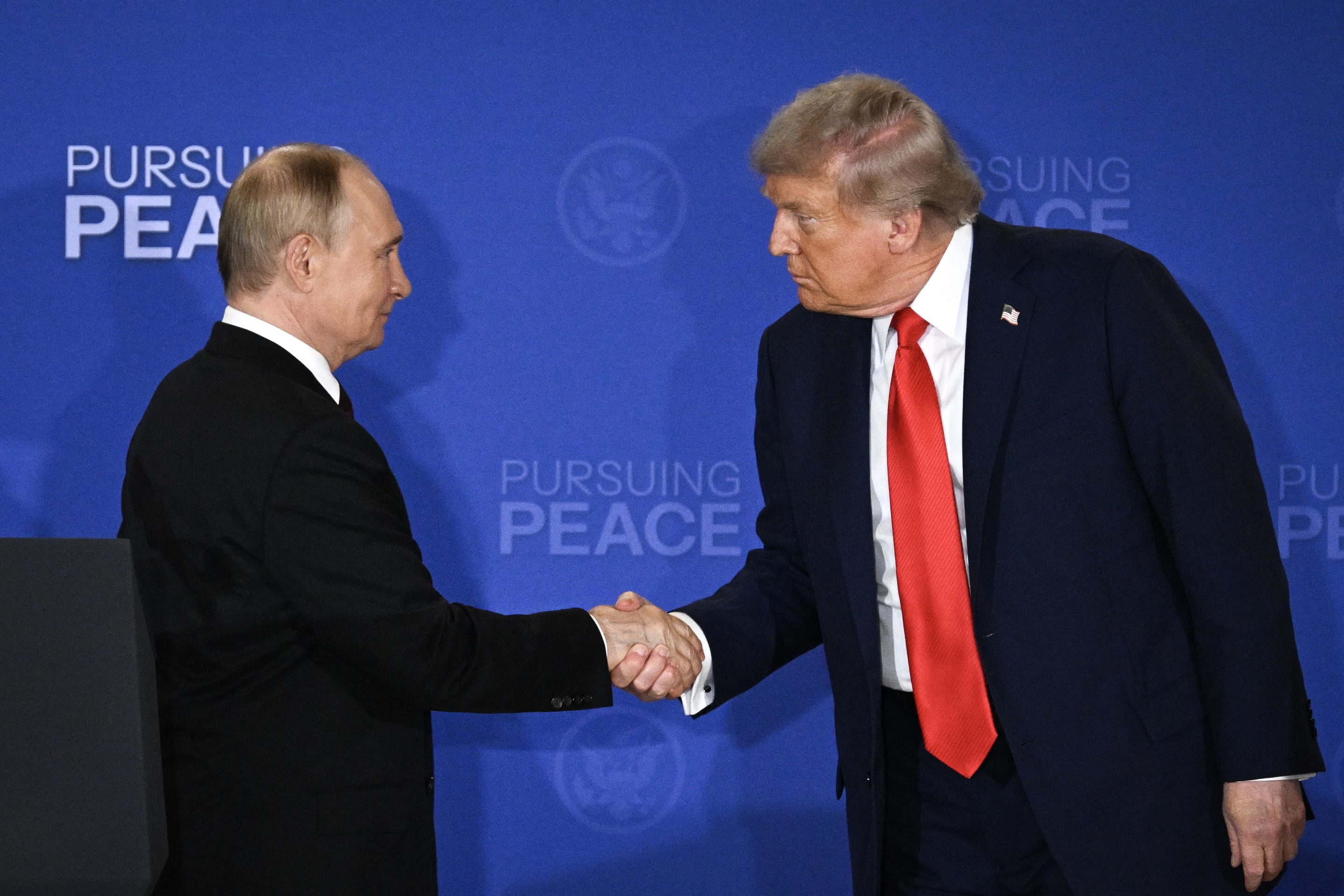 US President Donald Trump and Russian President Vladimir Putin shake hands at the end of a joint press conference after participating in a summit on Ukraine at Joint Base Elmendorf-Richardson in Anchorage, Alaska, on Friday.