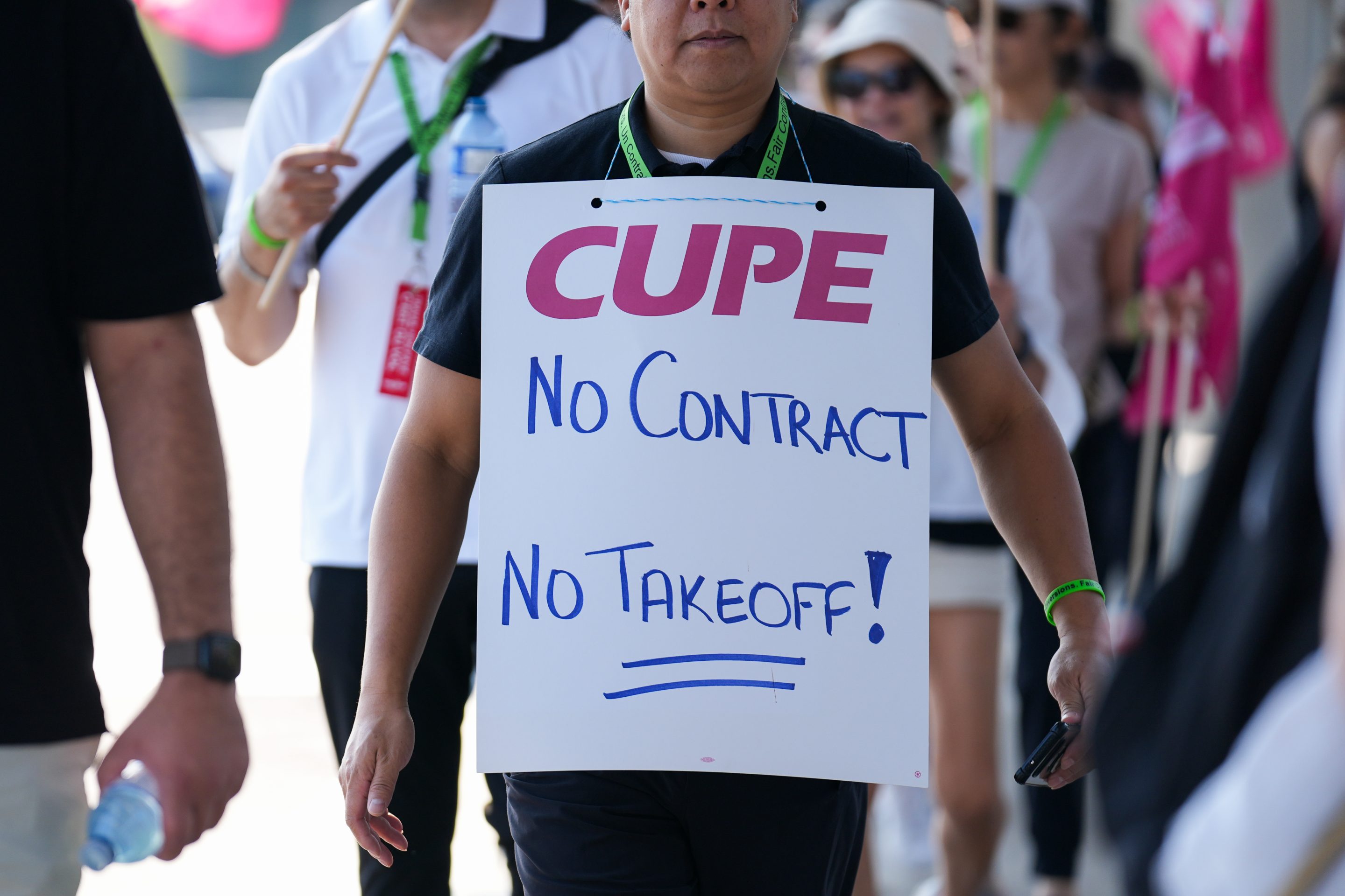 Air Canada flight attendants and supporters picket outside Toronto Pearson International Airport on Saturday.