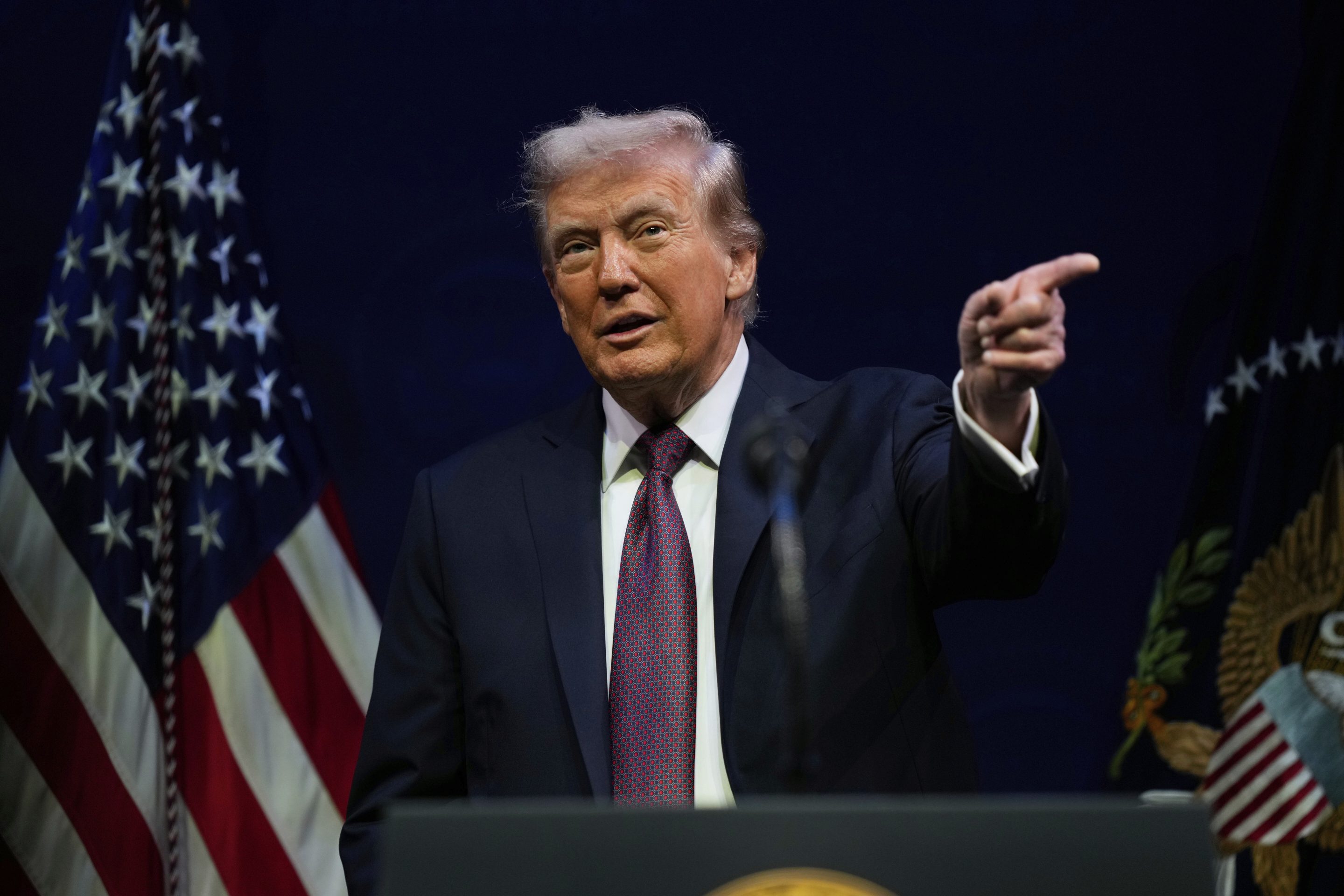 President Donald Trump, with a black background behind him, speaks at a hearing of the Religious Liberty Commission at the Museum of the Bible, Monday, Sept. 8, 2025, in Washington.