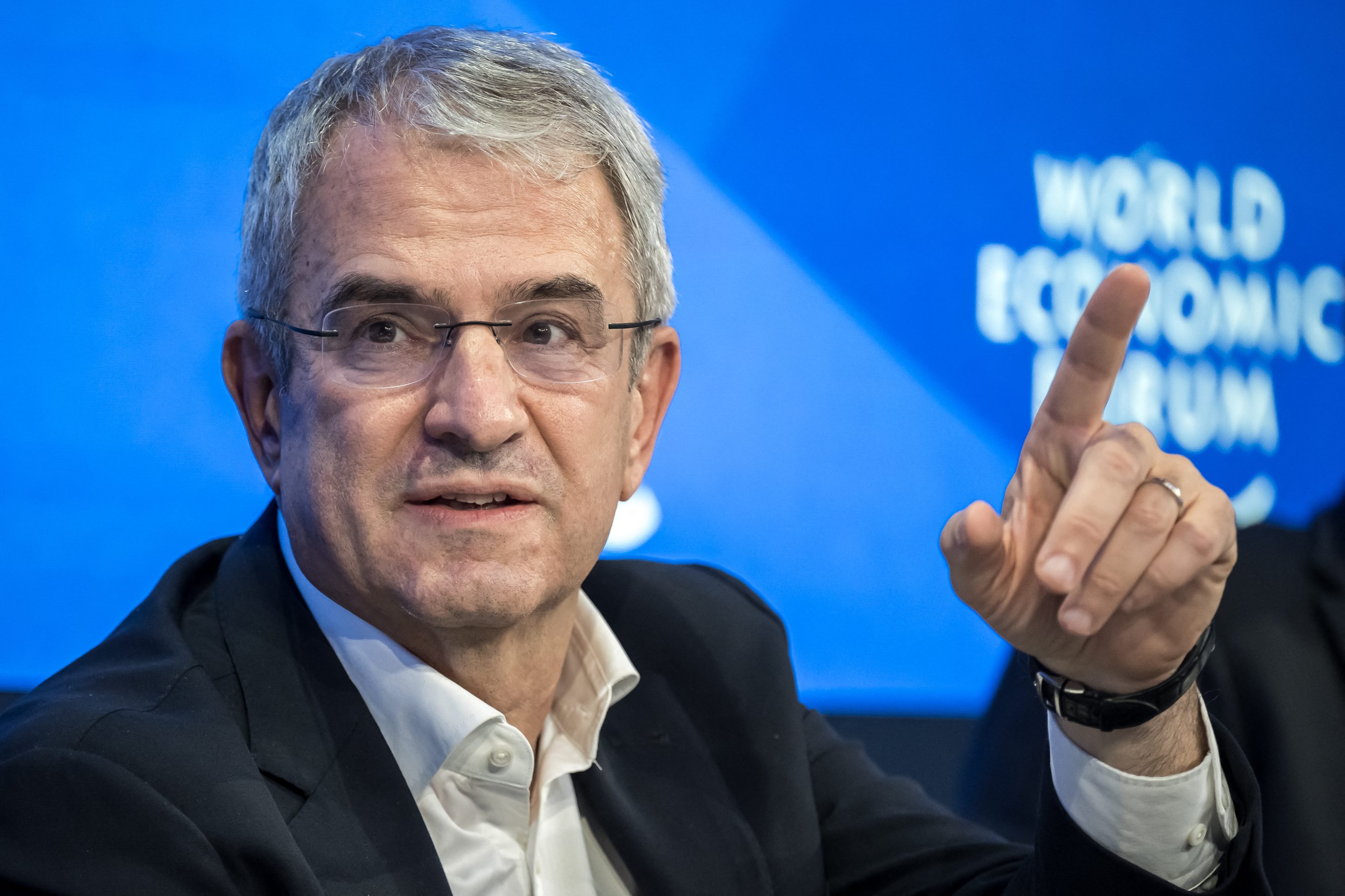 Nestle CEO Laurent Freixe speaks on stage in front of the World Economic Forum logo