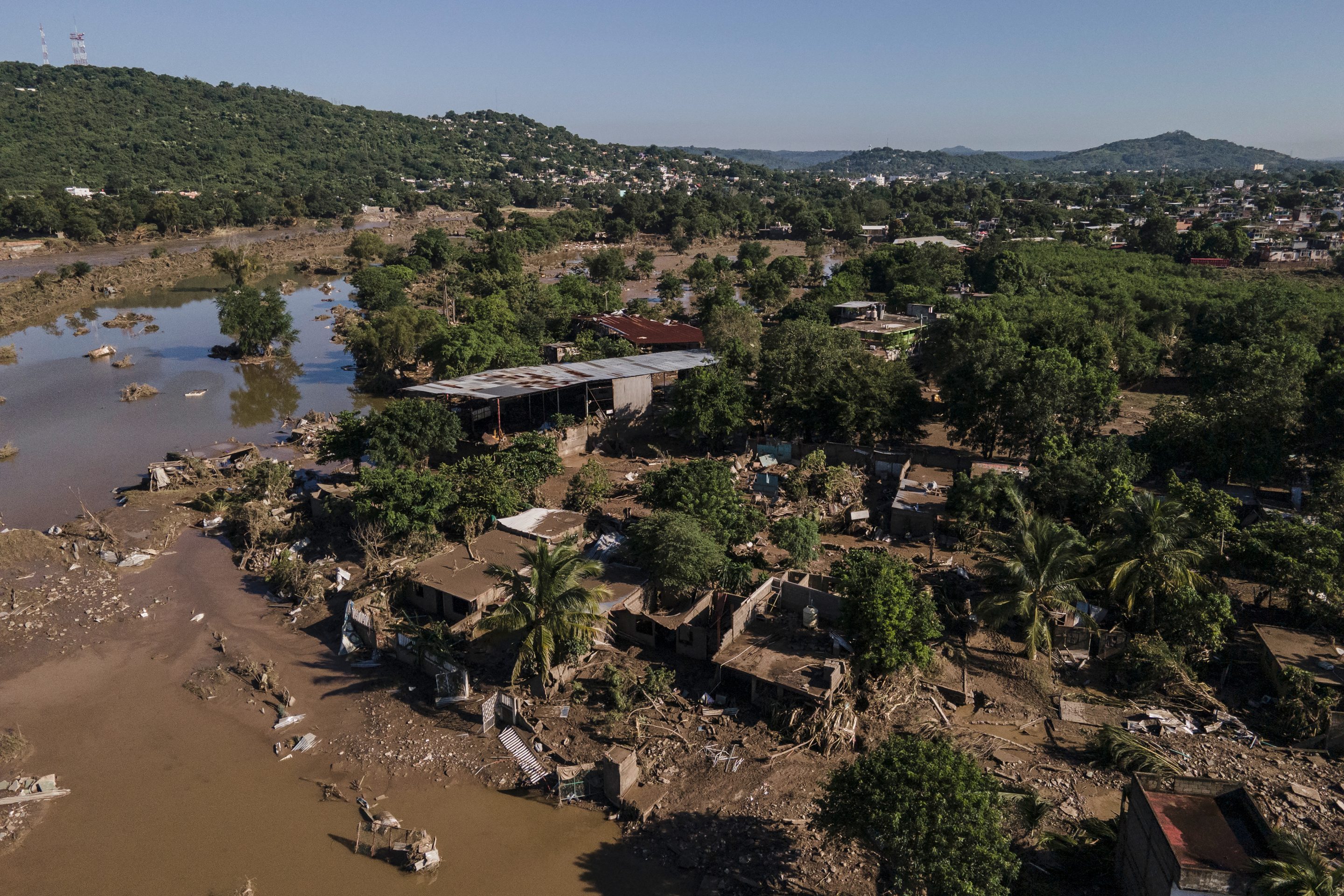 Houses sit damaged after flooding in Poza Rica, Veracruz state, Mexico, Sunday, Oct. 12, 2025.