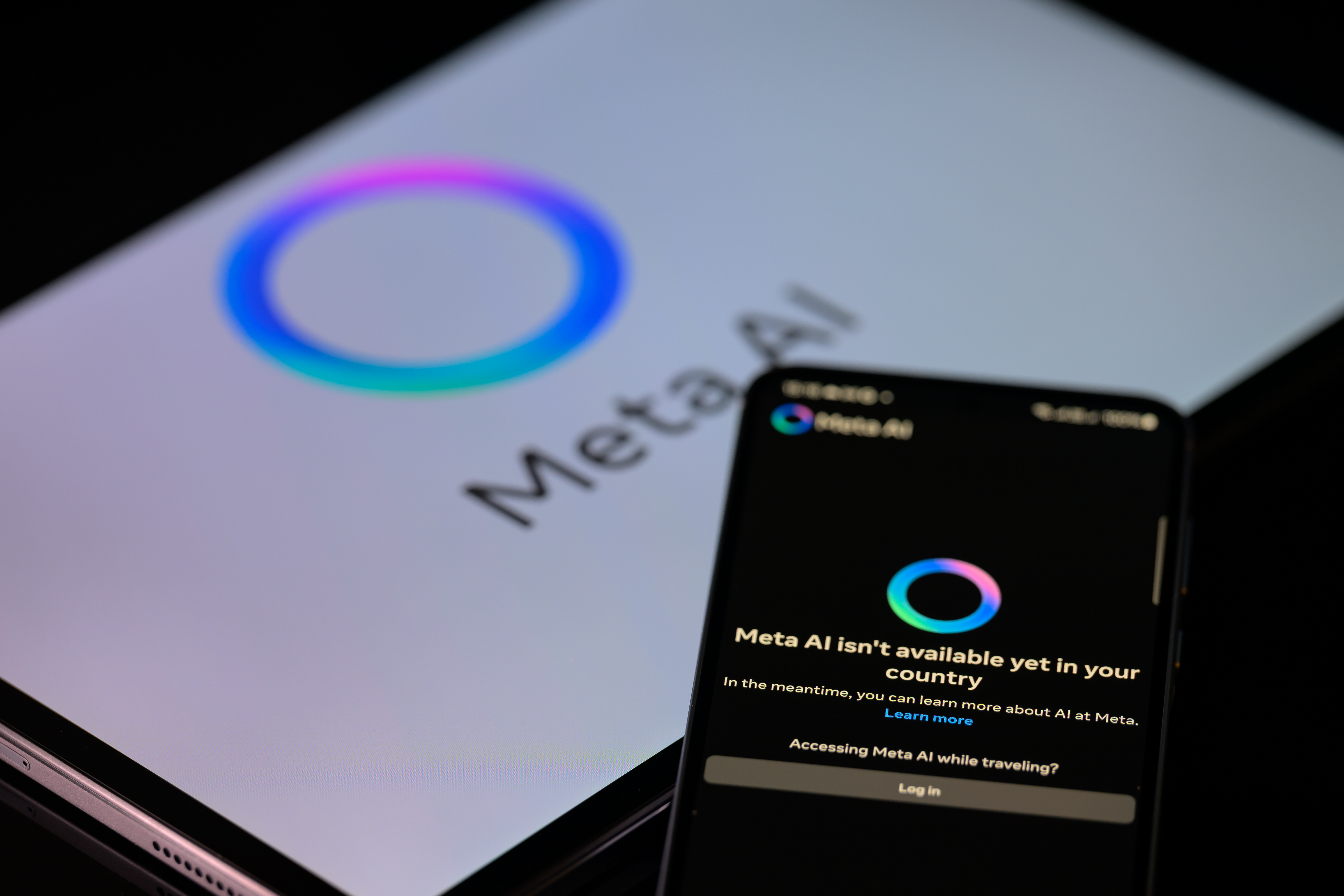 Meta AI on a laptop and phone.